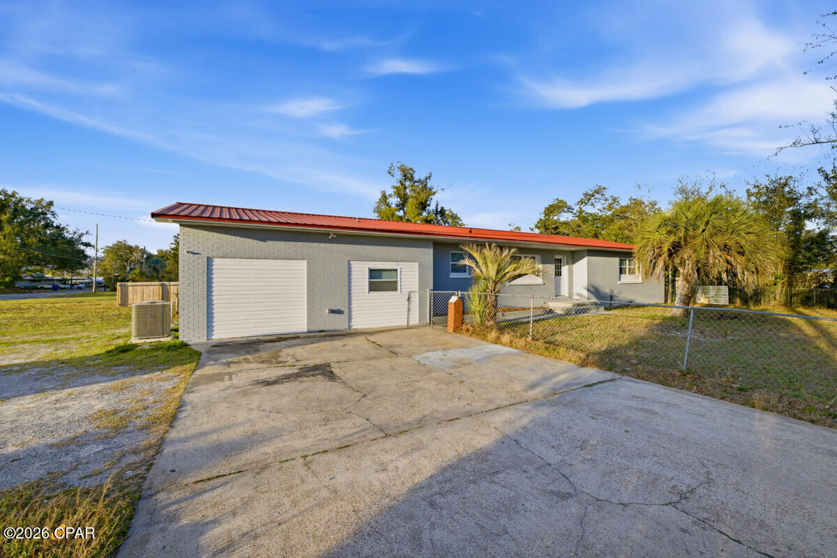 CURRENTLY UNDER CONTRACT, SELLER WILL CONSIDER BACKUP OFFERS. Welcome to this stunning, spacious home featuring 4 bedrooms and 3 full bathrooms. Situated in a beautiful, quiet neighborhood, this completely remodeled solid brick home offers a nice curb appeal and high-end craftsmanship. Brand new kitchen, bathrooms, HVAC, windows, flooring, and a newer metal roof.
This home is perfect for multi-generational living in-lieu of its size, spacious nature and thoughtful architecture. A dedicated section of the home, having its own means of ingress and egress, would serve as a mother-in-law suite with its own private kitchen and bathroom, but could also be used for short or long term rental purposes to maximize income and/or utility. Please listen to this: beneath the nearly 2000 sq ft main living areas, this property boasts a well-lit lower level or basement that is heated and cooled, thereby providing an additional 1200 sq ft of ample space for a game room (pool tables, table tennis, x-box consoles, etc.), home movie theater, home office, toy/play room, storage, or even as a shelter from the stormy elements!! It is endowed with several large insulated windows that let in natural light. This singular feature of this property is an absolute rarity in this part of the world. In a nutshell, this home allows endless possibilities and unparalleled versatility. The living room's French doors lead to an enclosed, screened back porch for pleasant outdoor views and natural light, providing ample relaxation to watch the sunset while sipping your favorite drink. It then leads outside to the sprawling backyard all around the house, having more than enough room for any exterior ideas such as a pool, garden, pole barn, or a full oasis. A few palm trees already adorn the front of the property. 

The features and benefits go on and on. The property is a corner lot and is accessible via 2 separate entrances (one from each of the adjoining streets), thereby providing ample parking for any number of cars, RVs, or boats you may have. You would have no fears about bringing the party home. This special property is located at the heart of the city, just minutes from white sandy beaches, hospitals, shopping, and dining. And at this price, there is simply nothing else like it in the area. Make it yours!