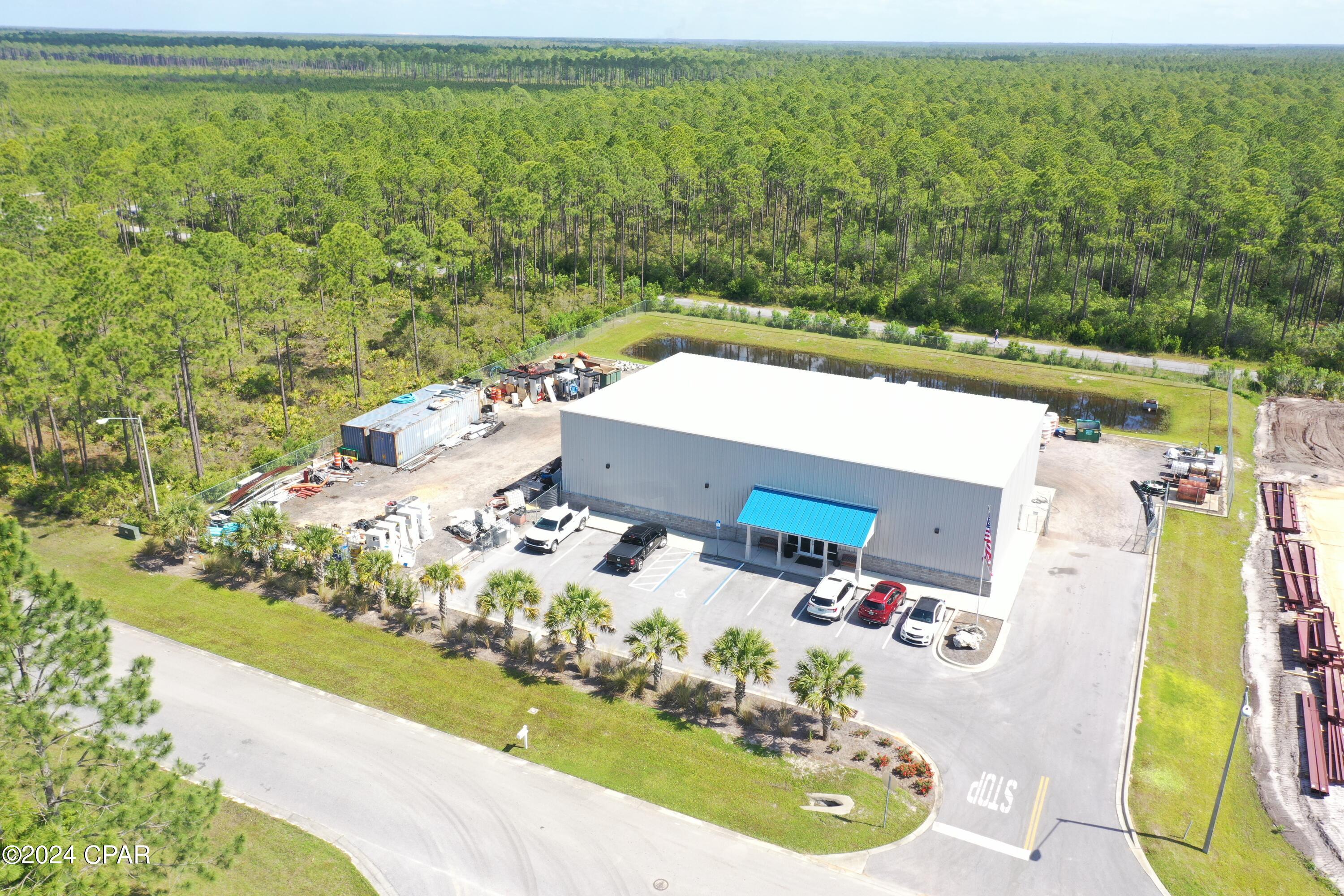 Fantastic 'flex' building for sale in Beach Commerce Park. Built in 2020. The 7,500 square foot building includes 3,000 square feet of quality office space on two floors. Warehouse space is on both sides of the offices. Huge conference room, 3 bathrooms, one includes a shower. 21' to 24' eave height. Three 12' x 14' grade-level rollup doors. Secure fenced yard space. 3-Phase, 400 Amp electrical service. The site is engineered to add an additional 3,000 square feet. The Civil and construction drawings are attached.