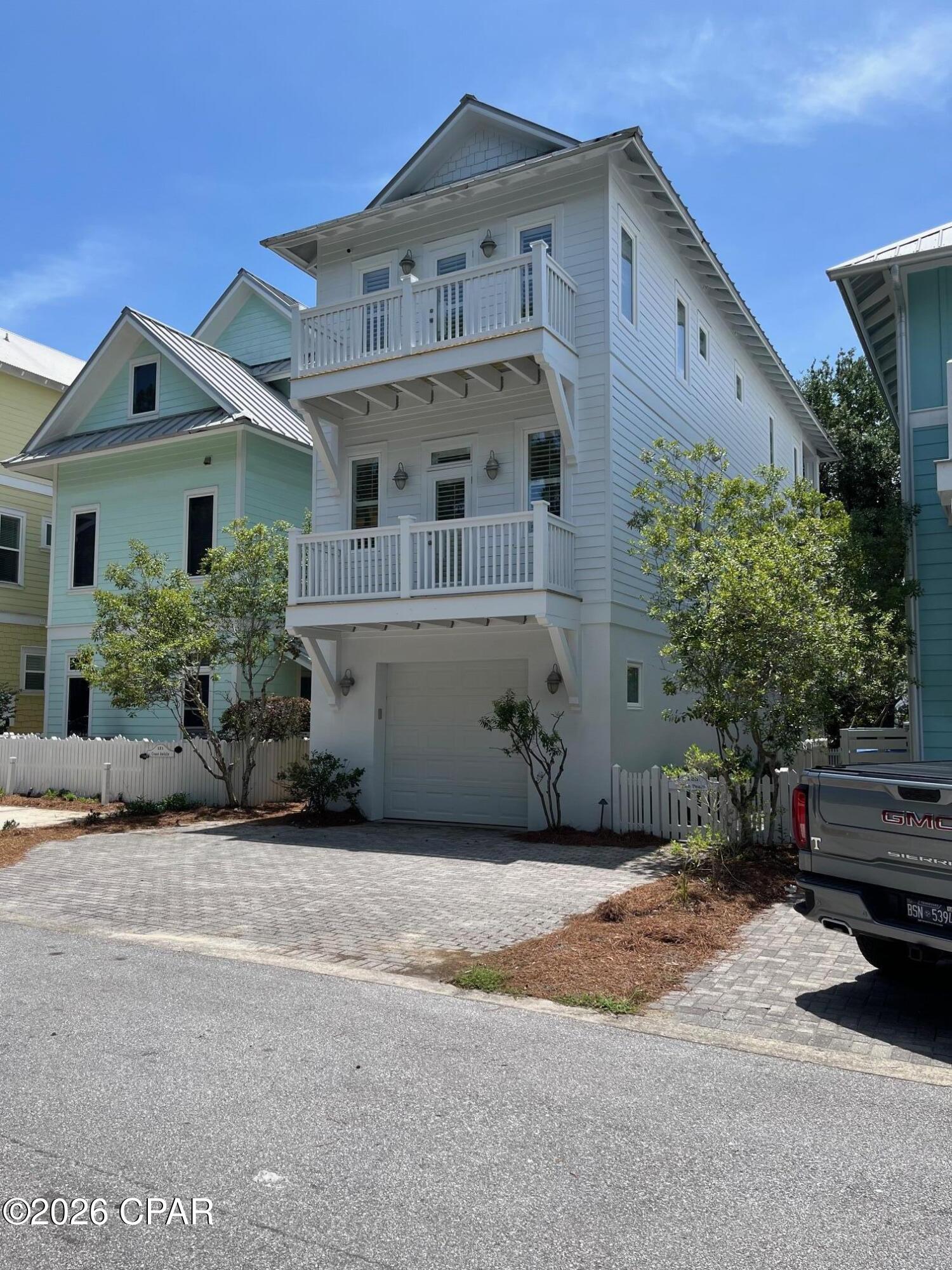 Welcome to Carillon Beach, a breathtakingly beautiful gated gulf front community where nearly a mile of pristine beach awaits your arrival, inviting you to unwind and create lifelong memories! This enchanting 3 story house in the charming Cottage District boasts a picturesque lighted path meandering through native plants, leading you to the vibrant Bellview Pool, Basketball Courts, and the exciting Pickleball Court! You're also just a stone's throw away from the beach! This incredible house features an innovative inverted floor plan, with the kitchen perfectly positioned on the second floor, offering a unique twist on traditional living! Another outstanding feature is the rare one car garage, a true gem in Carillon! This expansive 3 bedroom, 3 bathroom home with bonus room is designed to provide ample space for you and your loved ones to relax, unwind, and cherish quality time together! For added peace of mind, the seller has meticulously maintained the exterior, ensuring a worry-free experience for you! Additionally, Carillon Beach offers an impressive array of amenities, including three pools, one of which is beautifully situated gulf front! Don't miss this incredible opportunity to own a piece of paradise!