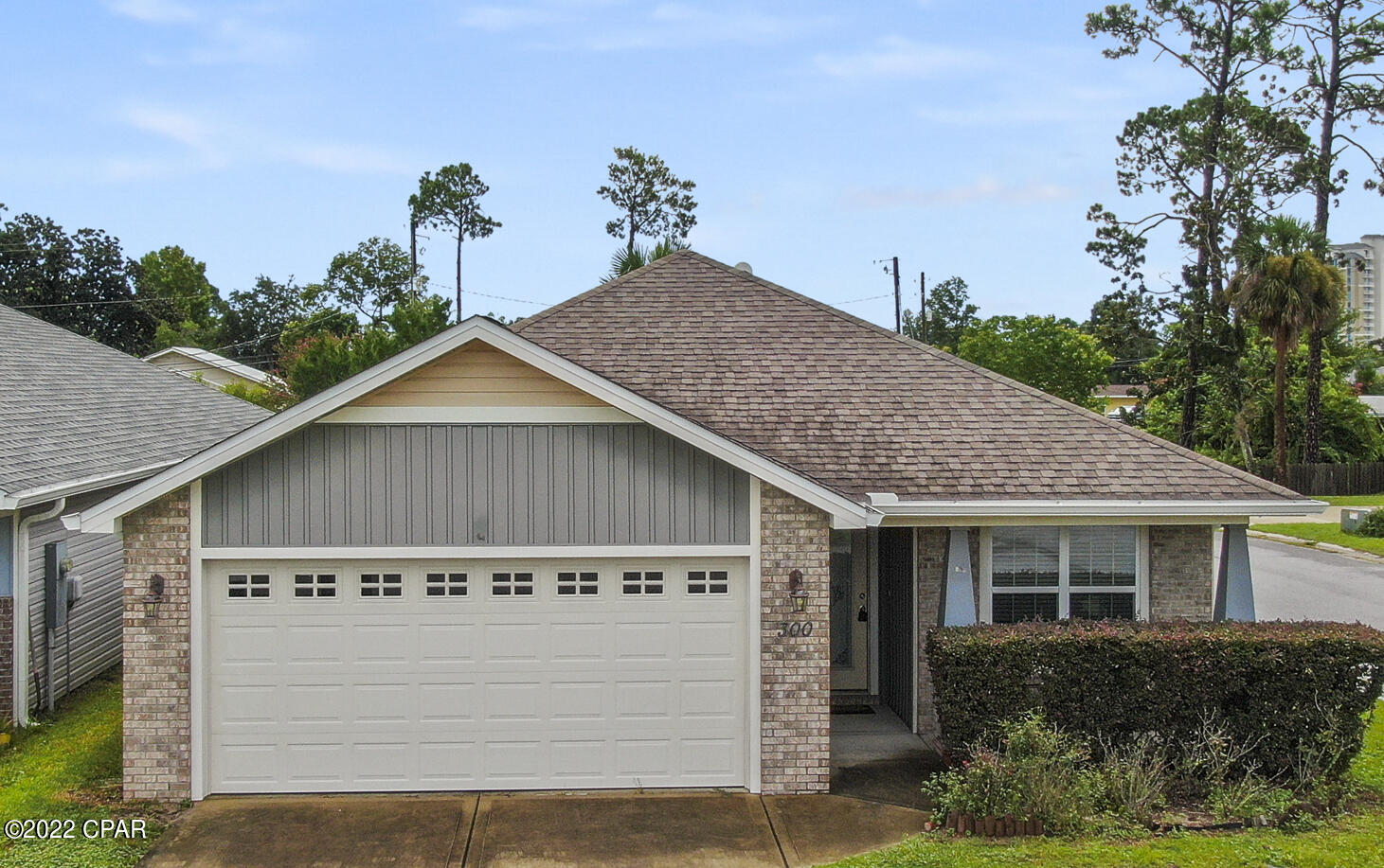 CURRENTLY UNDER CONTRACT, SELLER WILL CONSIDER BACKUP OFFERS. Located in a quiet neighborhood conveniently located to both Panama City Beach or Panama City. The adorable home was built in 2014 in Woodlawn Village. The cozy three bedroom, two bathroom home, 2 car garage is located on the east end of PCB. The adorable home was built in 2014 in Woodlawn Village on a Corner lot, extra parking area, SimpliSafe security system already wired to all windows, Walk in tub in master bathroom,  privacy fence in backyard