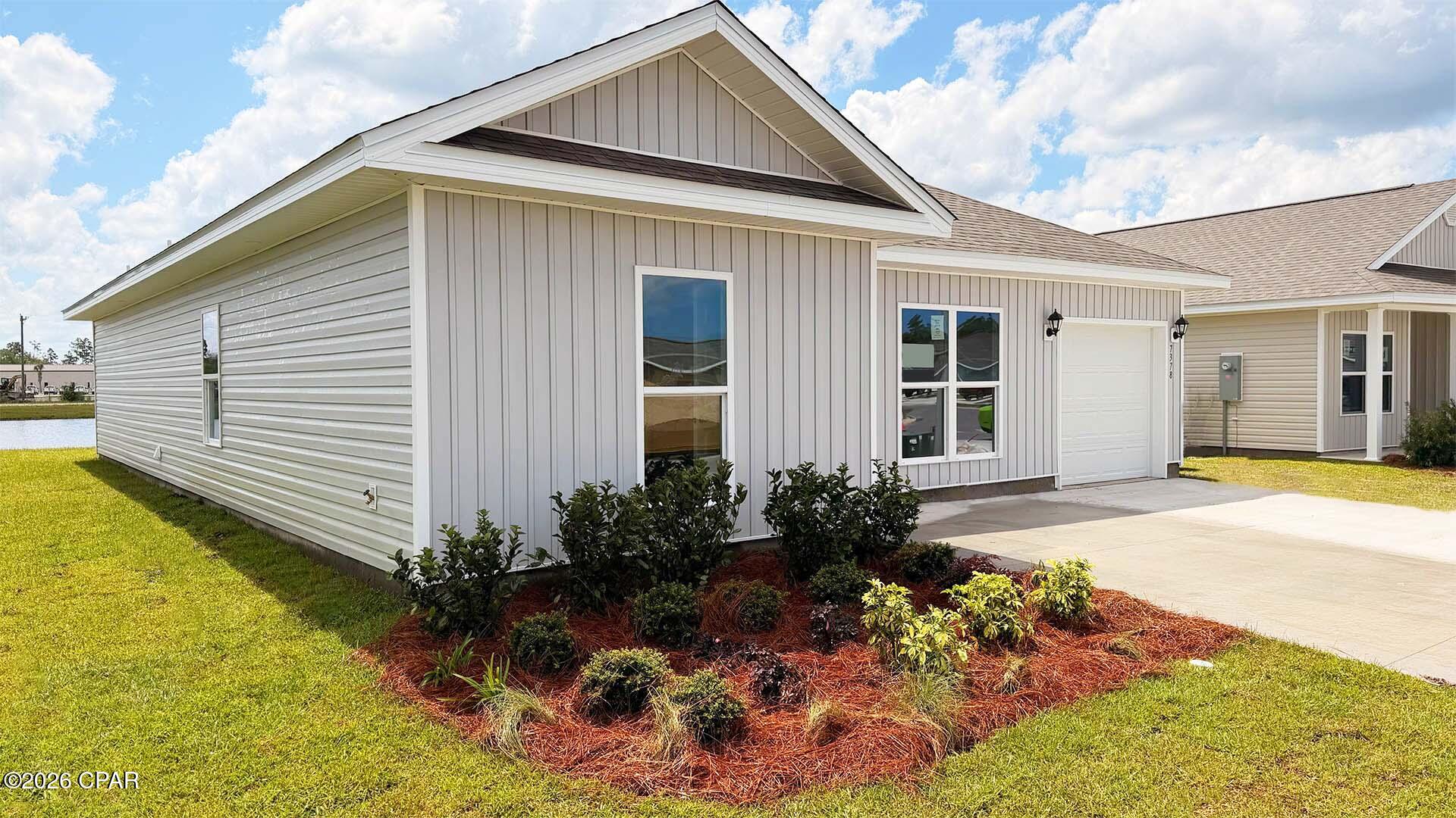 Welcome to the Sutton Plan, one of our new plans at Liberty in Panama City, Florida. The Sutton is a spacious single-story home with 1,439 square feet of comfortable living. This beautiful home offers 4 bedrooms with 2 bathrooms, and a 1-car garage. As you enter the home, the foyer welcomes you with beautiful EVP flooring which spans throughout the home in the main areas and bathrooms. Right by the front door are the 3 guest bedrooms, a full bathroom, and down the hallway is the laundry room and storage area leading into the kitchen and living room. Each bedroom boasts plenty of space and sizeable closets for organization with soft carpet flooring.

The kitchen is equipped with beautiful granite countertops, stainless steel appliances, and beautiful white cabinetry. The pantry is located next to the laundry room across from the linen and coat closets. Natural light illuminates this main area for your family and friends to enjoy. The back yard features a back patio located by the primary bedroom and the dining area. The spacious primary bedroom features its own bathroom complete with granite countertops, a large walk-in closet, and a relaxing shower. Both bathrooms feature beautiful granite countertops and white cabinetry. In addition to all the features and amenities our Sutton plan offers, each is built with our Smart Home technology package, designed to bring the ease and convenience of life right to your fingertips.

On the outside of this popular plan, you will see durable vinyl siding, a rear patio to enjoy the spacious back yard. Sidewalks line the neighborhood streets for you to enjoy the beautiful Florida weather. Our Liberty community features underground utilities making it less susceptible to damage from severe weather leading to fewer outages and more reliable service. Residents of Liberty can enjoy exclusive access to two amenity centers, complete with two pools, a children's splash pad, two playgrounds for endless fun, a well-equipped fitness center, two pickleball courts and a basketball court to name a few things. To learn more about this home for yourself, call us to get connected today!