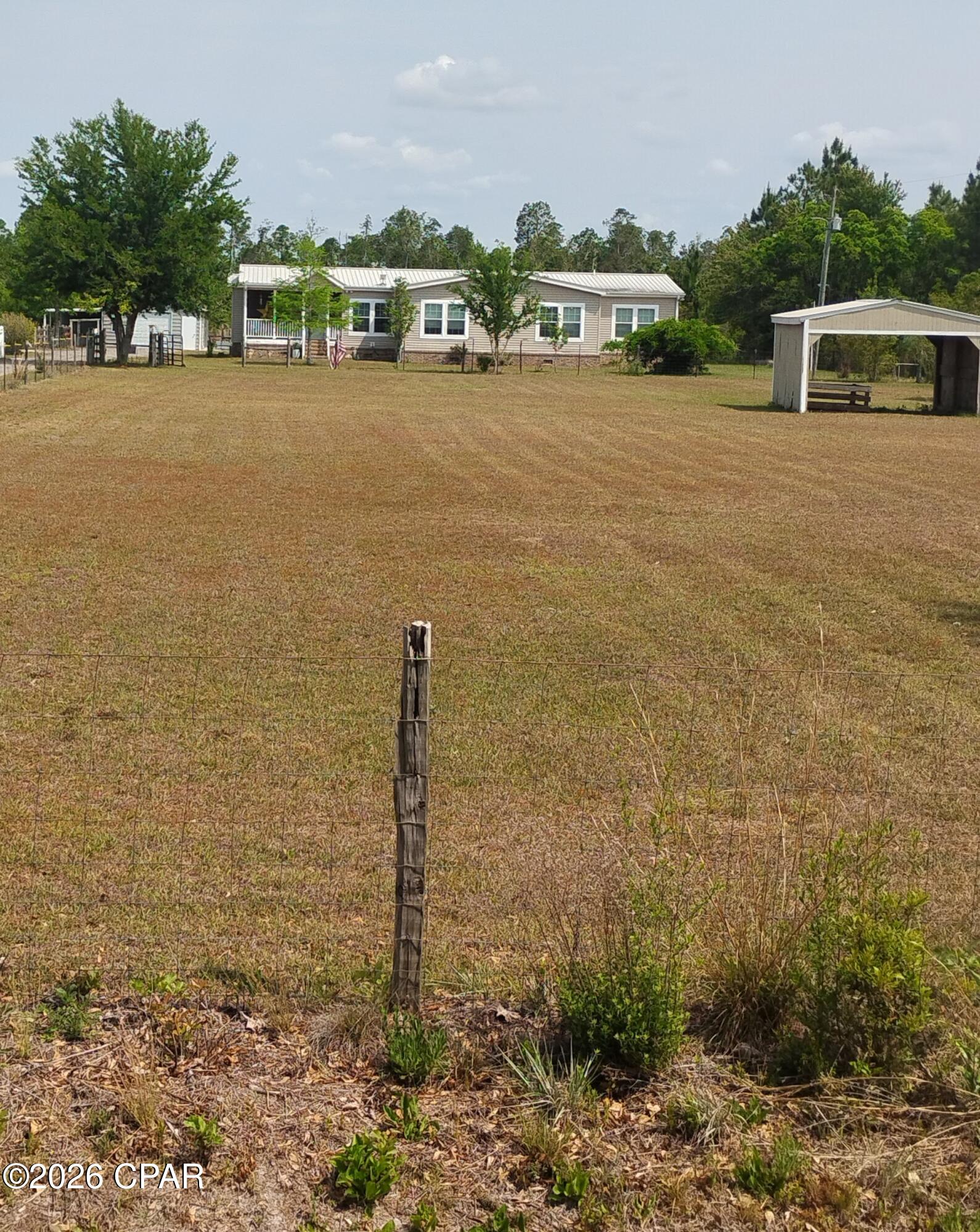 **CURRENTLY UNDER CONTRACT, SELLER WILL CONSIDER BACKUP OFFERS** Farm living is the life for me! When you come out to see this place you're absolutely going to fall in love with it. Its a 4 bedroom 2 bath home sitting on 7.2 acres with enough space to entertain your farm charm. Located in a quiet neighborhood, bring all of your beautiful fur babies bc they''ll love it too with plenty of room for new adventures for them. It comes with a dog run, a good size field for horses, goats and chickens, a covered carport, a pole barn located on the front of the property and a workshop on the back of the property, that comes complete with an asphalt driveway. The property is completely fenced in and gated in the front. Buyer to verify all pertinent information including sq footage and lot dimensions.