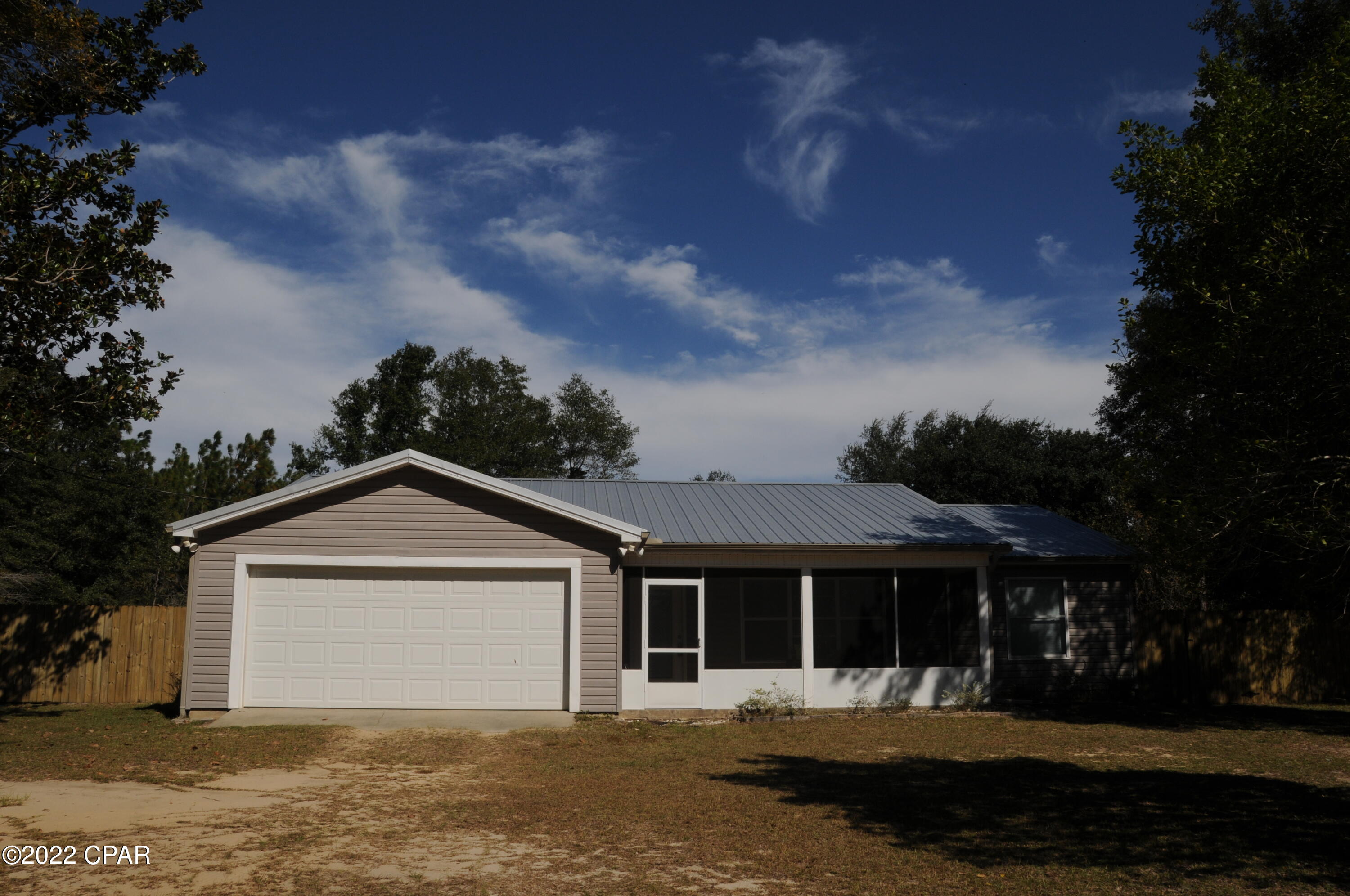 Hurry this will not last long. This beautiful country home is situated on 2.28 acres with plenty of room for an active family. This home has a wonderful open floor plan with a split bedroom plan giving plenty of privacy. The primary bedroom has a bathroom with a sperate shower jacuzzi tub  and walk in closet.  This home has a lot of up grades and is move in ready. New Metal roof,  6 foot privacy fence in  front and one acre  chain link fence in the back , and Starlink can convey with home. The seller is offering a 5,000 dollar contribution towards closing costs or rate buydown with a full price offer.