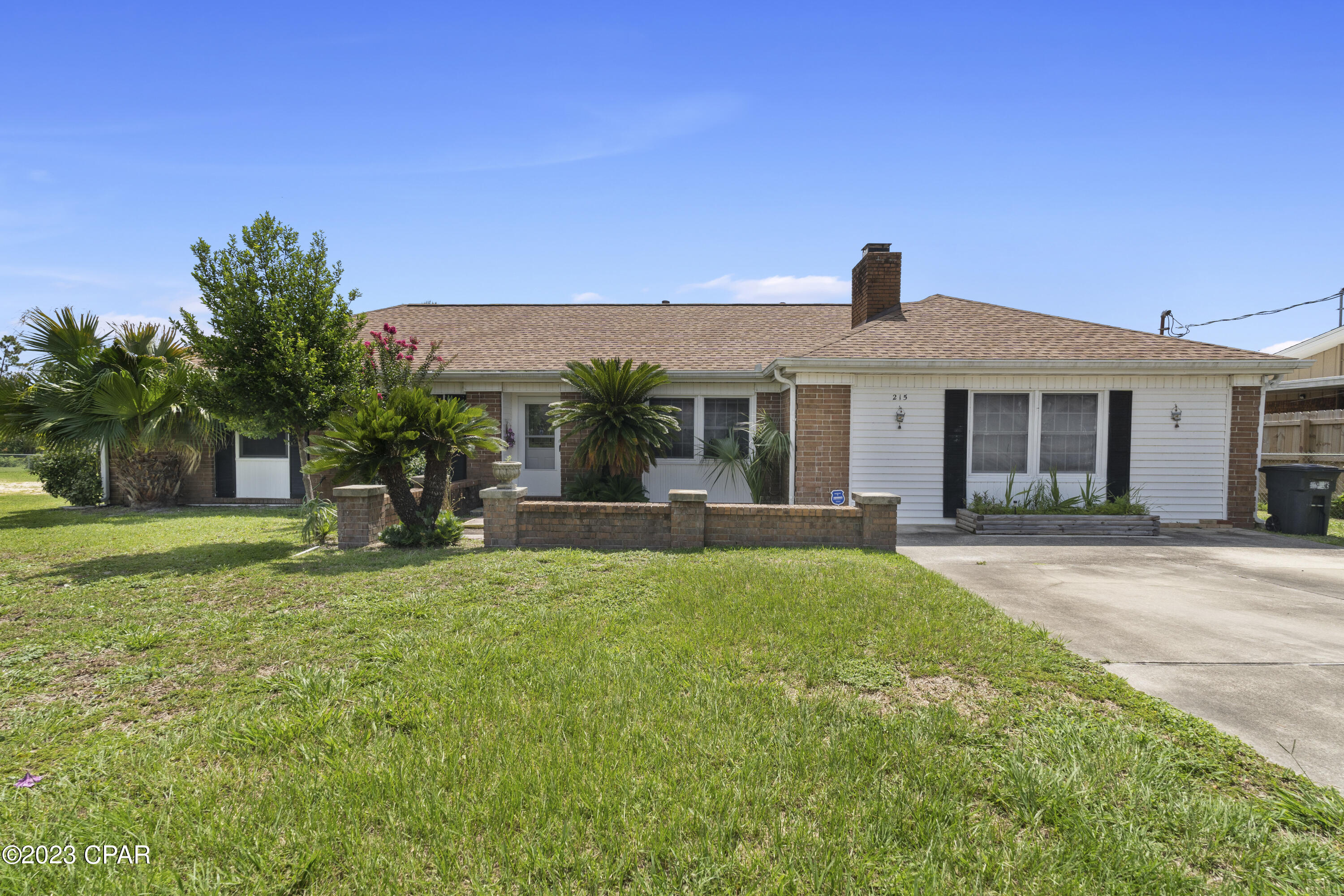 Welcome to 215 Lannie Rowe in beautiful Panama City! This stunning all-brick home offers the perfect blend of good solid construction and serene waterfront living.

Featuring three bedrooms, this home is ideal for families or those looking for extra space. Step inside to discover the tastefully renovated interior, showcasing new floors throughout and freshly painted walls that exude a sense of style and freshness. With a roof that was replaced in 2020 (sheathing and all). 

One of the standout features of this residence is the huge covered back porch, providing a fantastic space for relaxation and entertaining while enjoying views of Sudduth Pond. Imagine sipping your morning coffee or hosting gatherings in this tranquil outdoor oasis.

Situated on an expansive 1/2 acre lot, this property offers ample room for outdoor activities, gardening, or simply basking in the beauty of nature. With grapefruit, lemon, orange, and banana trees already in place you literally have an oasis in your backyard. The large detached garage is supplied with power and is a great space for extra storage or a workshop. With nearly 2000 sq ft of living space, there's plenty of room to spread out and make this house your home.

Conveniently located in Panama City, you'll have easy access to a variety of amenities, including Tyndall AFB, shopping centers, restaurants, parks, and schools. Whether you're seeking a peaceful retreat or a place to create lasting memories, 215 Lannie Rowe is ready to be your forever home!
