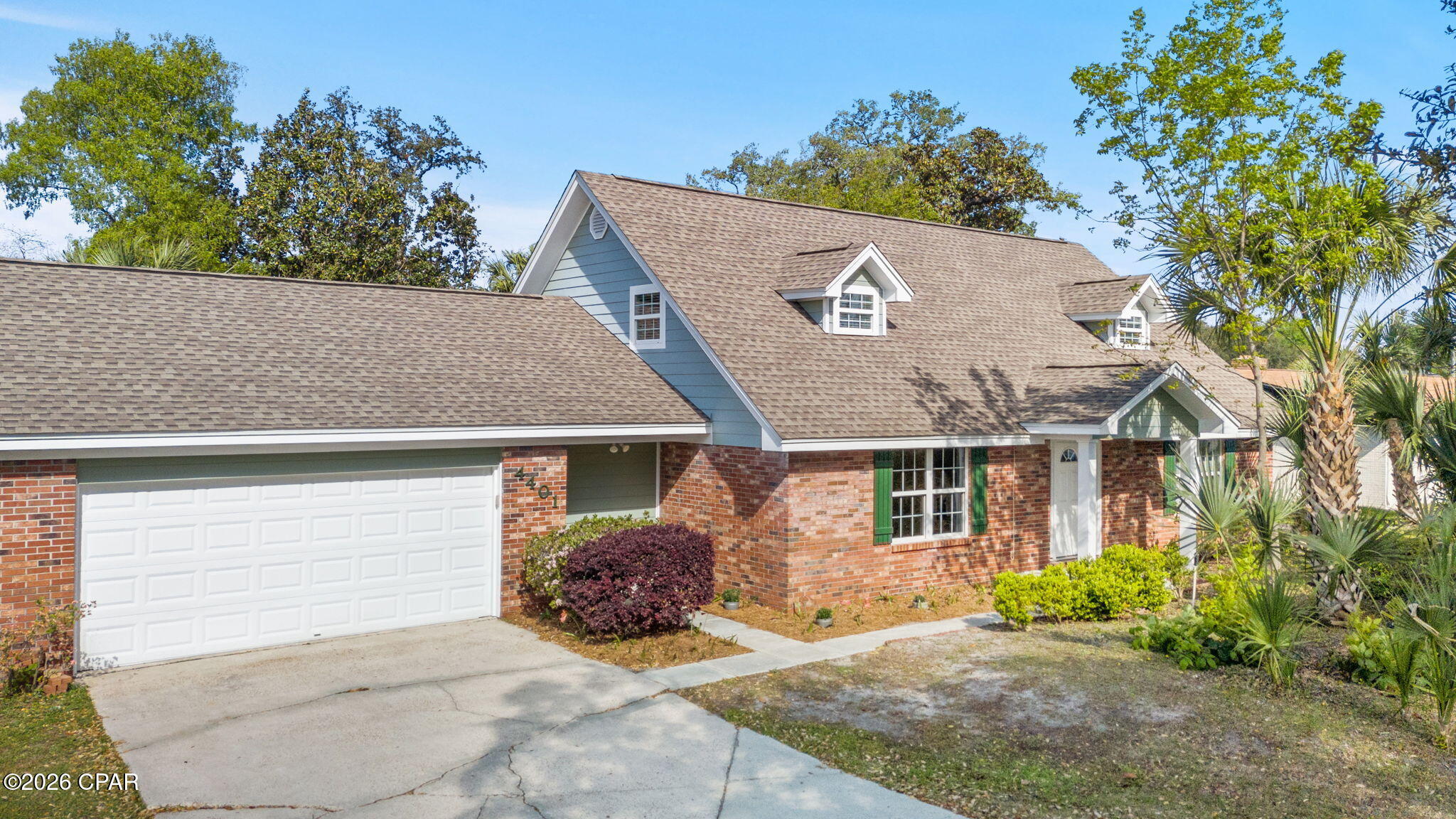 Located in the heart of a well-established Lynn Haven neighborhood, this charming traditional home at 4401 Cindy Lane offers a refreshing alternative to the modern open floor plan. Spanning 3,374 square feet, the layout features intentional, defined spaces and multiple flex rooms that provide privacy and endless options for a home office, gym, or hobby suite. The interior has been freshly painted, highlighting classic architectural details like the beautiful wood-burning fireplace that serves as the home's cozy centerpiece. The true showstopper is the completely enclosed sunroom, which is flooded with natural light and offers a serene, versatile sanctuary for year-round enjoyment. With four spacious bedrooms and two bathrooms, there is plenty of room to grow within this character-filled residence. Beyond the front door, you are perfectly positioned near local shops and dining, with easy access to Hwy 390 for a quick drive to the beach. This home is a rare find for those who appreciate classic charm and the luxury of having a dedicated place for everything. This home is MOVE-IN READY! The home inspection has been done and everything has been repaired. It's been painted, professionally cleaned, and is ready to go!  The homesite is just short of 1/2 acre with fenced backyard and NO HOA or dues!