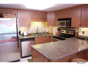 Beautifully remodeled first floor unit (not ground floor) overlooking the Tower's heated indoor/outdoor pool and the crystal clear waters of the Gulf of Mexico. From the gourmet kitchen with its stainless steel appliances and granite countertops to the custom-made commercial room-darkening draperies and a game center for children, you will find that the owners have gone the extra mile to make this unit a special and comfortable haven at the beach. The upstairs master bedroom has its own private balcony overlooking beautiful Lake Powell and the boat docks at Pinnacle Port. Pinnacle Port Resort is situated on a 25+ acre site within a beautiful gated community and has over 1/4 mile of beach frontage! The complex has lots of amenities including two swimming pools, tennis courts,