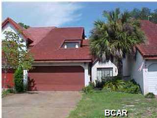 Lynn Haven Country Club! 3BR 2 1/2BA townhome with 2 car garage, overlooks the water, tile and carpet floors, fireplace, stairway overlooks the kitchen and the living area, balcony off master bedroom & overlooks water, deck on main floor and deck over the water, backyard and courtyard in the front.