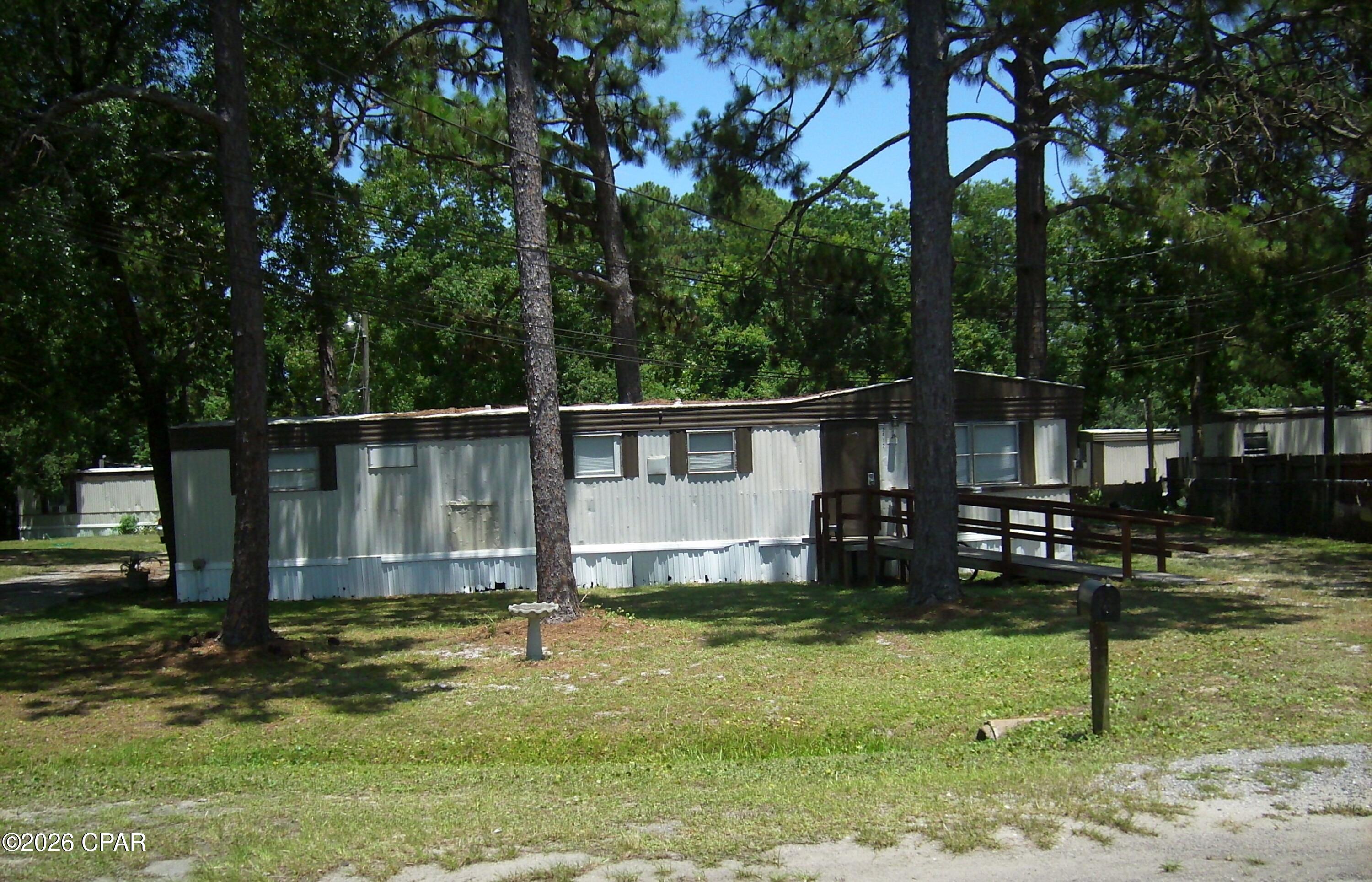 This investment collection is part of 3 lots that can be purchased individually or all together. This one is Parcel ID's 27779-015-000. The existing mobile home is occupied. Potential remodeling could add value to the mobile home and property. 

The property is zoned R-2(BC) which permits two townhomes to be built or a duplex. Buyer can purchase one property or all three at one time. Each property has it's own septic and sewer is available nearby. A power pole is also on each property. The white mobile home and the storage unit on 2412 Dorothy A&B does not convey. Possible financing available with a builder to build your investment/income property.