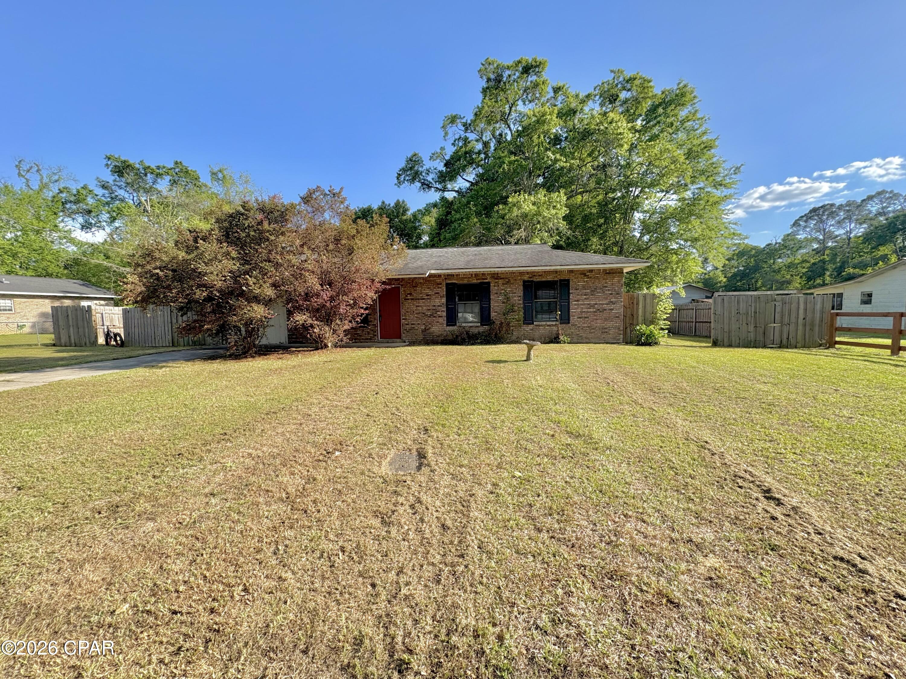 Solid brick home on a slab located in the city limits of Chipley. This 1992 home features 3 bedrooms with another room that could serve as a fourth, one bathroom, and an inside laundry room. There is a large backyard that is mostly privacy fenced and a spacious screened back porch. Updates include a shingle roof put on in 2017 and a central a/c in 2018. There are also solar panels on the home that will be completely paid off at closing, enjoy lower power bills! With some cosmetic updates inside like paint and floor covering, it would be easy to bring it up to its full potential! If you're looking for your own home, it will be cleaned out and ready to go upon closing. If you're looking for an income producing opportunity; with tenants already in place, this could be a great opportunity to add a rental to your portfolio that is already producing. Cash or conventional financing only.
