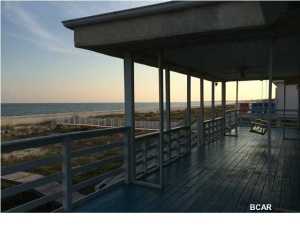 Finally, a home you can afford right on the beach!! Spectacular views from the living room, master bedroom, additional bedrooms, balconies and porch on this large Gulf front lot. Located on the quiet, dead end street of Gulf Pines, this home has plenty of room for parking, boats, RV'S, cars, offering two garages (three car plus) and lots of parking and lots of other storage! The second floor is the main living area. The kitchen is open to the large living area with a fireplace and panoramic views of the Gulf. The living room has 17 ft tall ceilings. The split floor plan offers a master suite and additional bedroom with bath en suite and the laundry room. The whole third floor with minor modification can be a huge third bedroom. The baloncy deck is huge, plenty of room for hammocks and