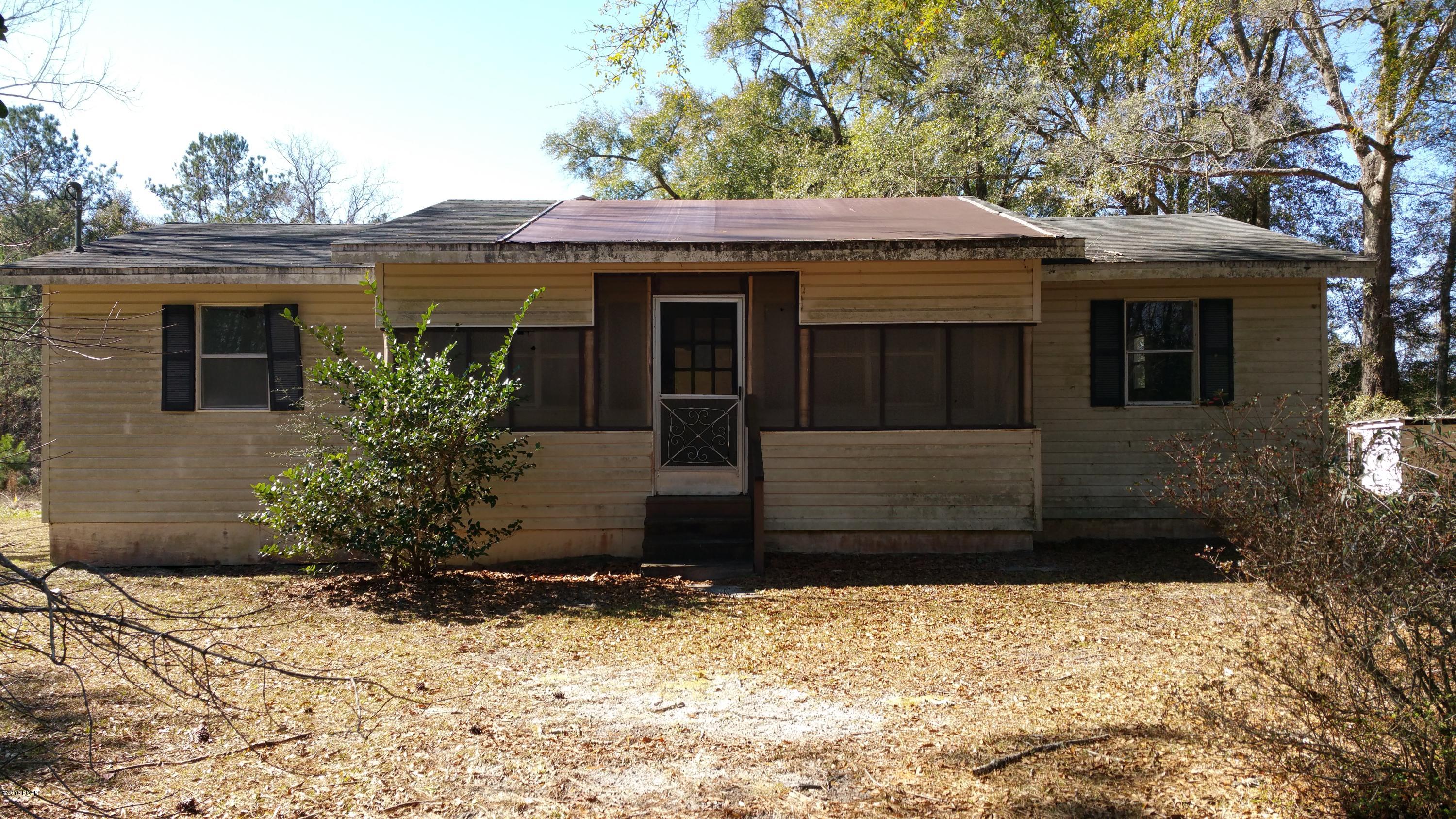 4-Bedroom Home on 5 Acres in the Country !!  Located on a paved highway only 35 minutes from the Beaches of South Walton.  Home has 1716 square feet with 4 bedrooms, 2 baths, and a bonus room.   This home needs floor covering and ceiling repair in some of the rooms.   Land is mostly wooded with plenty of room for animals or a garden.