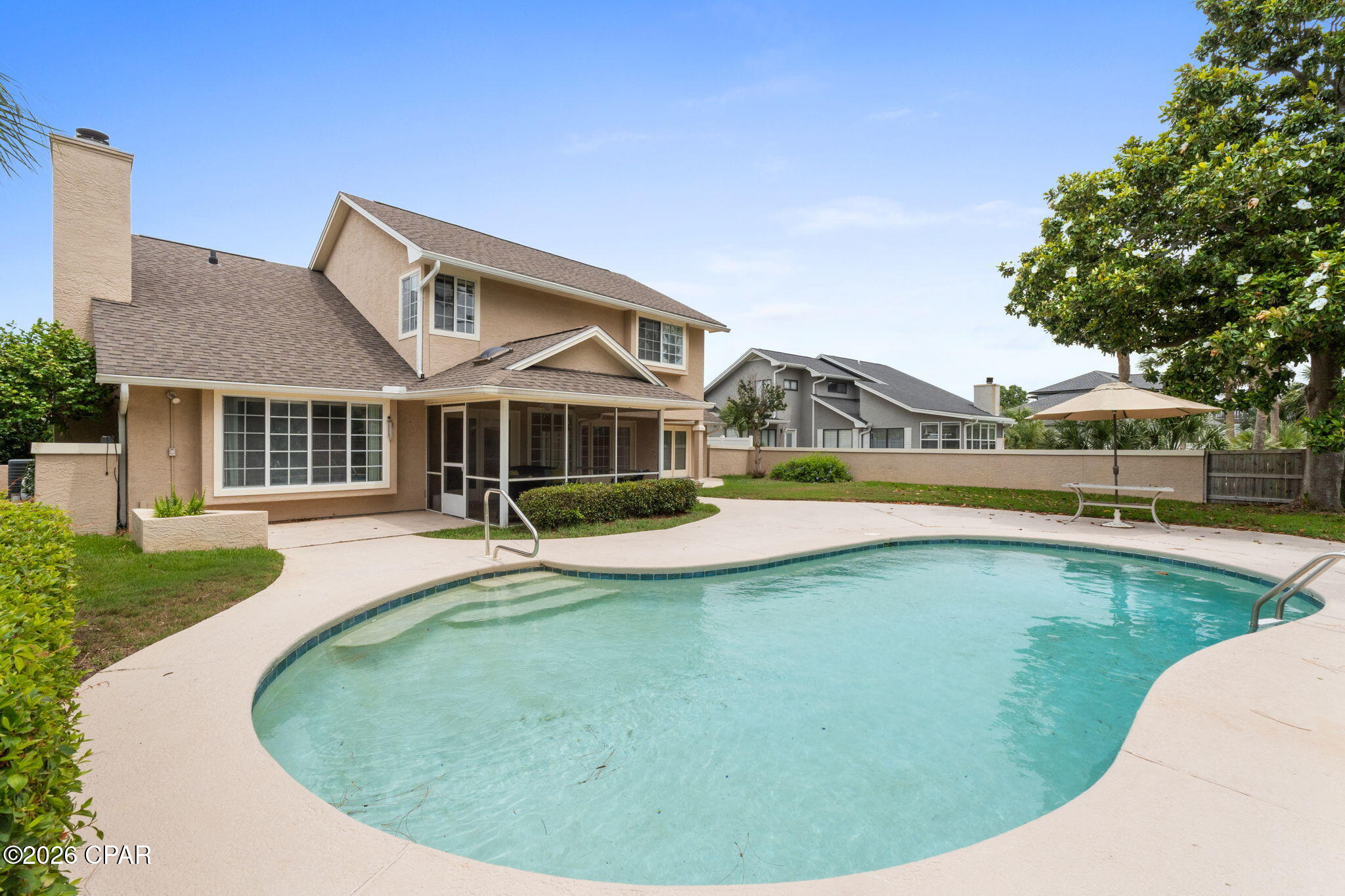 CURRENTLY UNDER CONTRACT, SELLER WILL CONSIDER BACKUP OFFERS. Nestled within the prestigious gated community of Bay Point, this spacious 2,598-square-foot home offers the perfect blend of comfort, functionality, and coastal living. Featuring 3 bedrooms, 2.5 bathrooms, a loft, office/flex room, and two separate living areas, this home provides plenty of space for both everyday living and entertaining.

The thoughtfully designed floor plan features a spacious kitchen that seamlessly flows into the dining area and out to the screened back patio, creating the perfect indoor-outdoor living experience. Overlooking the large backyard and sparkling inground pool, this private outdoor space is ideal for relaxing, hosting guests, or enjoying Florida's year-round sunshine.

The primary suite is conveniently located on the first floor, offering privacy and easy accessibility. Upstairs, you'll find an open loft area, additional bedrooms, and a full bathroom, creating flexible living space for family, guests, or a home office setup.

Located in the highly sought-after Bay Point community, residents enjoy 24-hour gated security, a family-friendly atmosphere, and access to some of Panama City Beach's most desirable amenities. Enjoy Point South Marina, home of the famous Bay Point Billfish Tournament, the renowned Jack Nicklaus golf course, waterfront dining, community events, and so much more.

This home offers the perfect opportunity to enjoy the Bay Point lifestyle with spacious living, incredible amenities, and a prime coastal location.