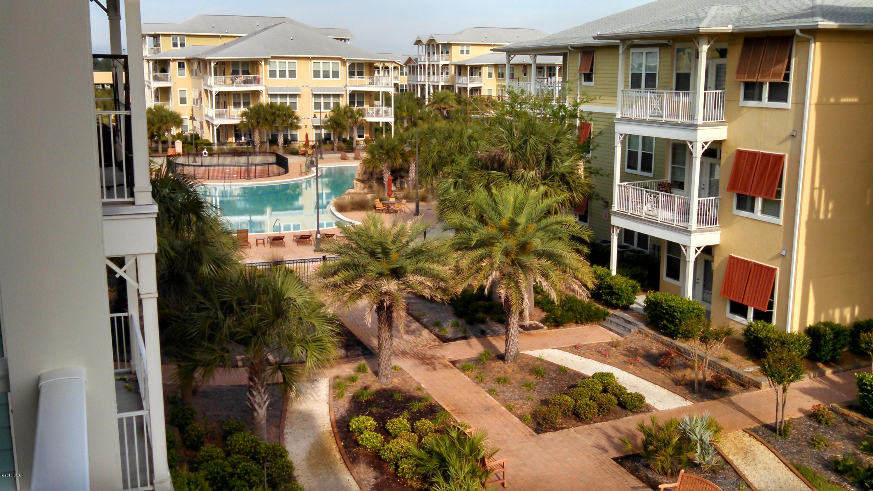 Experience an oasis at the beach. This is a two-story 1 bedroom, 1.5 bath townhouse-style condo. This unique floorplan is larger than the two bedroom condos, and features hardwood flooring in the main living area, tile in the baths and first floor hall, carpet upstairs in bedroom and his and her walk in closets. The well appointed kitchen includes granite countertops, stainless appliances, and custom cabinetry. This condo also has a washer and dryer upstairs, blinds throughout, two private balconies, and covered entry. Master bath boasts glass shower, separate garden tub, and his and her vanities. A large storage closet is an added bonus. Water, sewer, and garbage included. Pets are not allowed. Island Reserve is loaded with amenities, including resort pool with zero entry and waterfall.