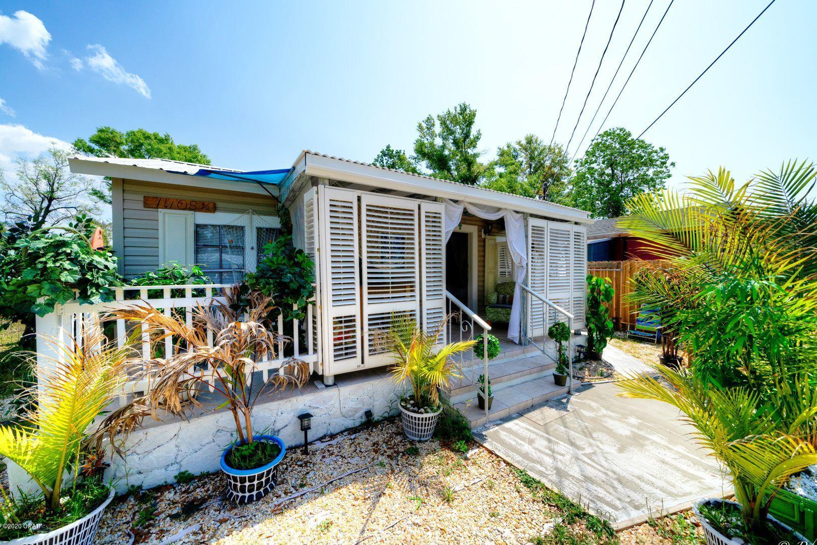 Fully Furnished,Remodeled 2 bed/2 bath Florida Cottage in the heart of St. Andrews. This ''key west'' inspired  home has a front porch that is semi enclosed with shutters. The kitchen is equipped with stainless appliances, white shaker cabinets and backsplash. The master bathroom is updated and features a tiled shower with glass sliding doors. The guest bath also has a tiled shower. The bedrooms and living room both feature an electric fireplace. Step onto the back patio to experience the tranquility and outdoor activity space this backyard has to offer. The backyard is fenced and has a lemon tree, grape tree, fire pit and a yard building that is perfect for extra storage or golf cart parking. This home is less than a mile to water, making evening walks a scenic pleasure. Metal roof and vinyl siding. Located near schools, parks, local restaurants, shops and more. Would be great for a turnkey short term rental. No Central HVAC, window units and fireplaces.