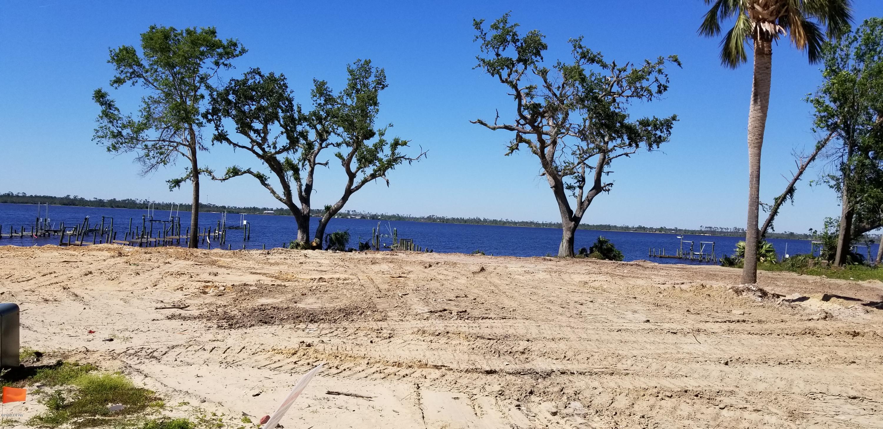 BEAUTIFUL WATERFRONT LOT READY FOR YOU. The view from this lot is Fantastic!! FREE ACCESS TO UNLIMITED SUNSETS AND MOON RISES!!! Repair the dock and bring your boat and watercraft.The last home was destroyed by the Hurricane. That has been completely demolished and hauled.  (The lot next door suffered the same fate (MLS 682843). It is also up for sale. Purchase both lots and have a beautiful 60' building site.)