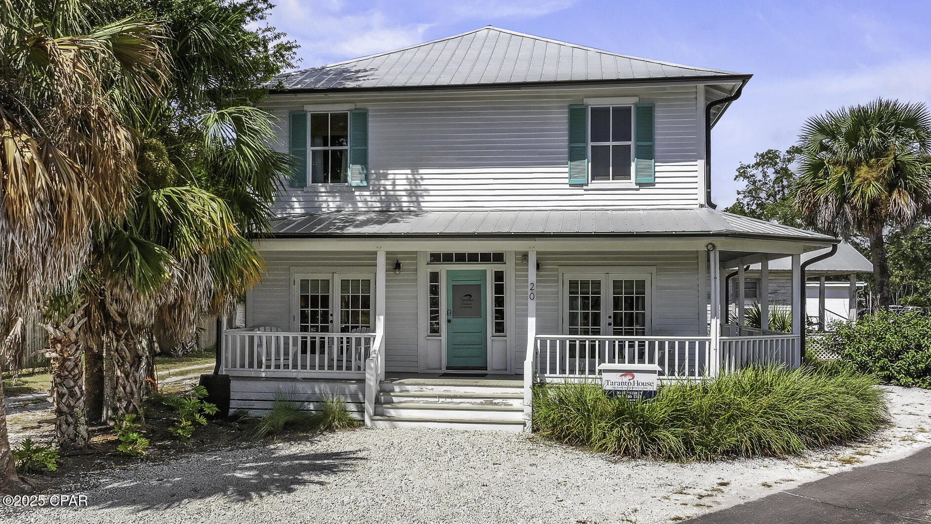 HISTORIC RENTAL GEM!! The distinguished Taranto House is named for the Taranto family & dates back to circa 1880. A beautifully restored historic treasure in the heart of enchanting Apalachicola, this 5-bedroom/5-bath residence seamlessly blends turn-of-the-century character with modern comfort, offering a rare opportunity to own a piece of local history. Perfectly positioned in the walkable downtown district, the home features five individually designed rooms, each with its own charm & each rented individually for maximum rental potential. Thoughtfully preserved to honor its historic integrity, the home has been updated with contemporary conveniences that enhance its appeal. Inviting shared spaces—including a comfortable common area & kitchen—reflect its hospitality roots while providing residential ease. From the lofty porches, enjoy glimpses of Apalachicola Bay & immediate access to the Big Bend Scenic Byway Coastal Trail. Just steps from galleries, cafes, boutiques & the waterfront, the location could not be more ideal. Shaded porches & quiet garden corners invite you to linger beneath moss-draped oaks, savoring coastal breezes & southern charm. For locals, the preferred method of travel is, bar none, by golf cart. Easy to drive, easy to park & the perfect way to let your hair down. Golf carts are a celebrated part of daily life here—often with a dog or two happily riding along offering the chance to explore more of Apalachicola's hidden nooks & crannies.  Whether enjoyed as a private residence or continued as a sought-after rental, this home offers both charm & versatility. Embrace the Apalachicola lifestyle—stroll to seafood markets, sip your morning coffee on the porch, explore local art studios & watch golden sunsets melt into the bay. This is more than a home—it's a living legacy. Don't miss your chance to own this one-of-a-kind treasure in a town defined by timeless beauty. Call for your private tour & LIVE THE BEACH LIFE!!