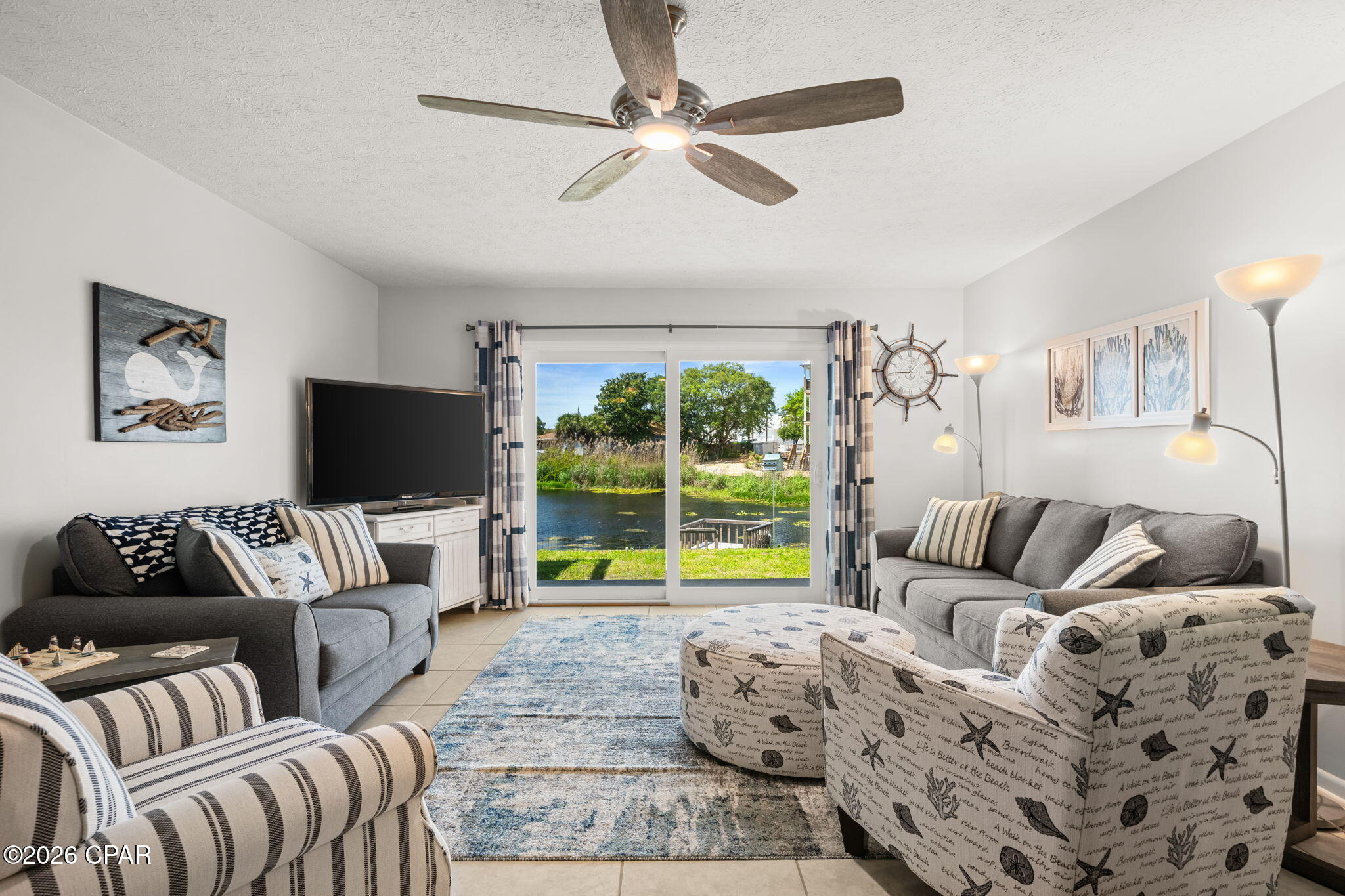 **NEW LOWER PRICE!!** Waterfront Townhome, one block from the beach, is for sale in Panama City Beach, FL. Located on the highly desirable West End. This hidden gem offers stunning lake views and a short walk to the Gulf--where you'll enjoy a quieter, more undeveloped stretch of beach, away from the crowds.  Truly the best of both worlds!
This middle-unit townhome has been lovingly maintained as a family's second home for many years and is ready for its next chapter.  These townhomes seldom come up for sale!  
Situated in the sought-after Gulf Vista community, known for its walkability to the beach and underground utilities.  This property offers a rare advantage--no HOA. Even better, short-term rentals are allowed, making this an outstanding opportunity for a variety of buyers. The front patio offers space for socializing and additional storage, while the balcony provides the perfect backdrop for relaxing by the water.
MANY Upgrades over the past few years makes this cute coastal unit,  move in ready!