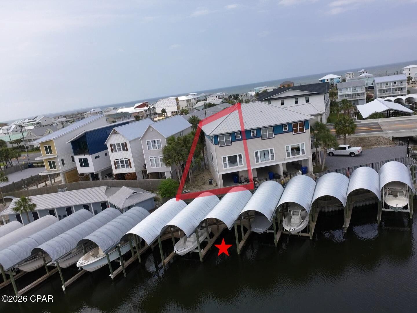 Canal Townhome with Covered Boat Slip in Mexico Beach and only 1 block to the beach. Unit #3 is a Furnished 2BR/2.5B townhome with 1,408 SF (H&C). LVF flooring, Tile Flooring, granite counters, and10' ceilings. Several storage closets. Covered parking on the ground floor with storage room and extra yard space. Upstairs first floor is living/dining/kitchen with a half bath. The top floor is Master Bedroom and bath; and additional bedroom with full bath. Both levels have a covered porch for views. Each covered porch has a storage closet. Additional social space just off the back yard . Within walking distance of restaurants and shopping. Fish off the dock in your back yard. Located in Mexico Beach harbor just one block from the beach. One block from public boat launch. One block from Mexico Beach visitors center. Great crabbing and good fishing just off of your private docks. What are you waiting for?