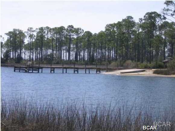 One of the best priced home-sites in Laird Bayou. It catches views of the water from across the street and offers amazing convenience to the community pool and boat launch. Along the ocean-blessed beaches of Florida's celebrated panhandle there is a place of rare harmony among things which brings pleasure to life. Magnificent natural beauty, abundant waterway recreation, a sense of place and the desire for privacy. For those to whom the good life is equal parts, water and land, this is paradise. This-is Laird Bayou. At Laird Bayou, the good life comes in waves through an array of planned amenities: Boat ramp, community boat and RV storage, pool and bathhouse. These pleasures will assure Laird Bayou residents an unequaled Gulf Coast life style within this private gated community