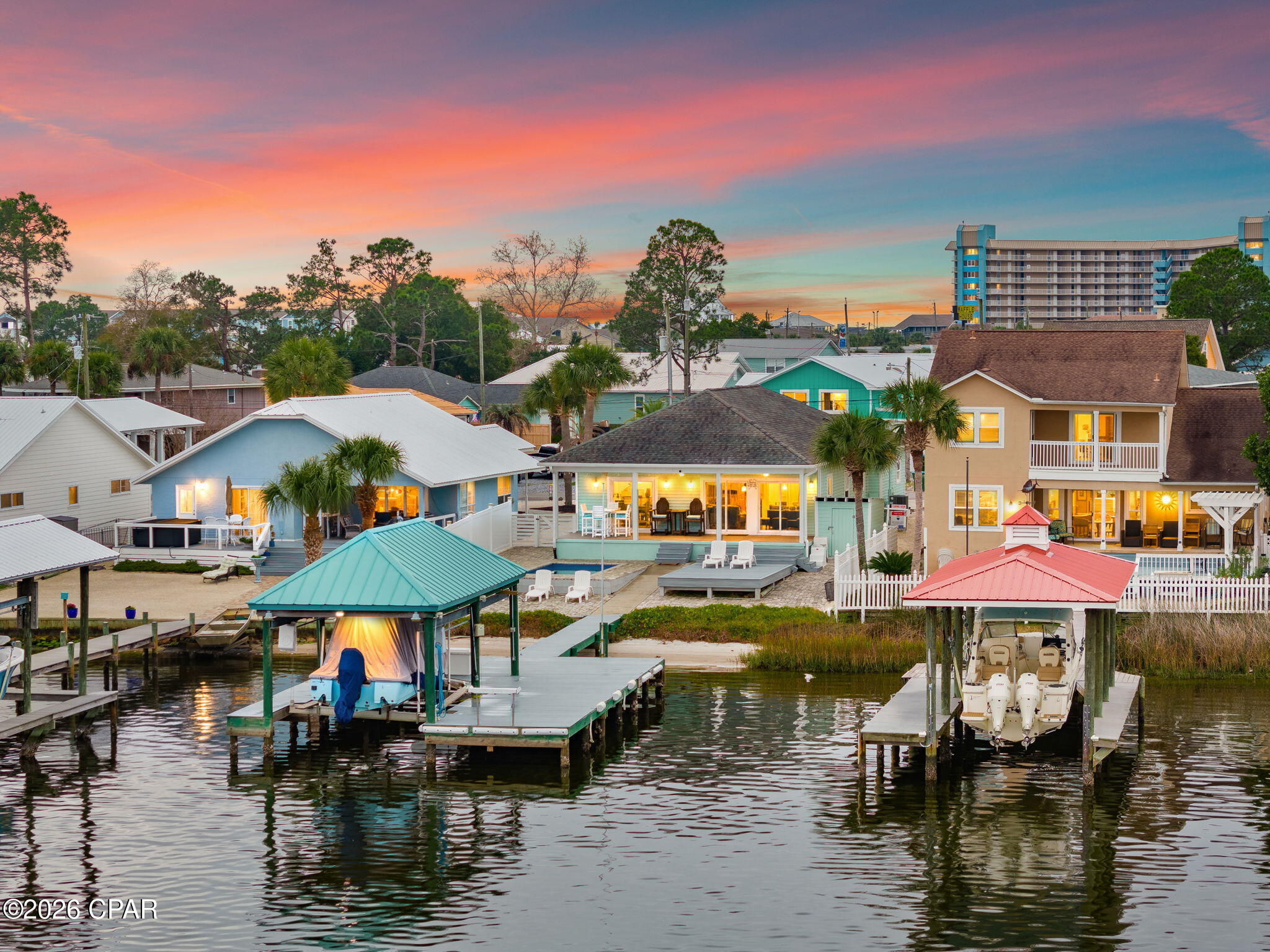 Discover your personal waterfront sanctuary on Grand Lagoon--a rare gem that blends effortless luxury with the serene rhythms of coastal life. This beautifully maintained 3-bedroom, 2-bathroom home offers 1,537 square feet of thoughtfully designed living space and panoramic lagoon views that will take your breath away.

Step outside and discover a private paradise designed for both relaxation and recreation. From the paver-lined drive to the low-maintenance Bahama rock landscaping, every detail speaks to ease of ownership. The Trex decking flows seamlessly to a covered dock outfitted with a boat lift, inviting you to launch into St. Andrew Bay or head straight to the Gulf. A heated and cooled pool ensures year-round enjoyment--ideal for cooling off on warm afternoons or enjoying a quiet dip under the stars.

Inside, the open-concept layout is bathed in natural light and oriented toward the water, framing postcard-perfect views at every turn. With furnishings negotiable, this turn-key retreat is ready for immediate enjoyment or prime for short-term rental income. Located just moments from the beach and surrounded by three convenient boat launches, it's the ideal home base for boaters, beachgoers, and dreamers alike.

Whether you're seeking a permanent residence, a vacation hideaway, or a high-performing investment property, this Grand Lagoon gem checks every box. Waterfront opportunities like this are becoming exceedingly rare--don't miss your chance to own a slice of paradise.

Reach out today to schedule your private showing. All information and measurements are deemed reliable however not guaranteed. Buyer should confirm all information.