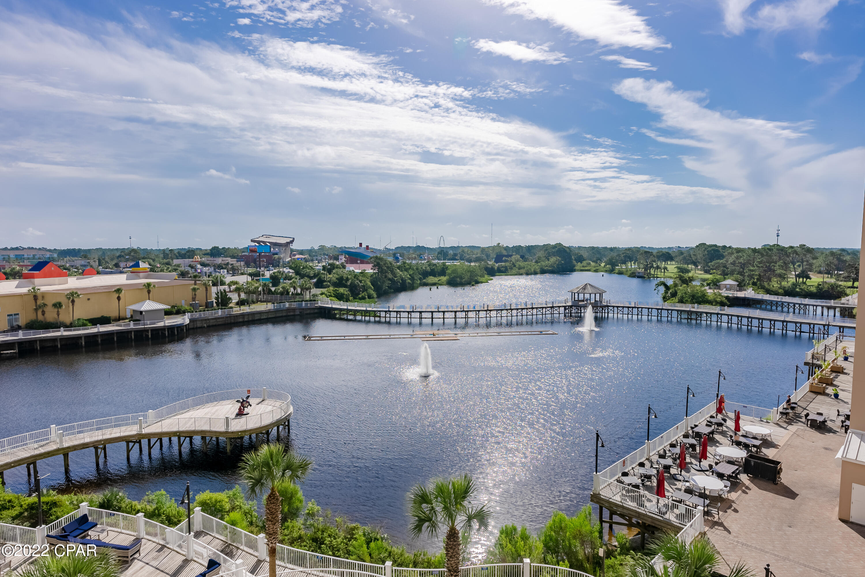 'CURRENTLY UNDER CONTRACT, SELLER WILL CONSIDER BACKUP OFFERS' ~ What a Great Deal on a 3 BR with 3 Baths located right across the street from THE BEACH.  The Main Bedroom has a very large Private Bathroom and a Walk-in Closet PLUS a Balcony overlooking the Pond & Dining. There is also an area to add Bunk Beds or use the area as an Office Space. The Kitchen Appliances are all new in Sept '22, the whole interior of the unit was just painted, all new Vinyl Plank Flooring, New Lights, New Ceiling Fans all in Sept '22. Age, SF, and Dimensions are approximate... please verify if Important.