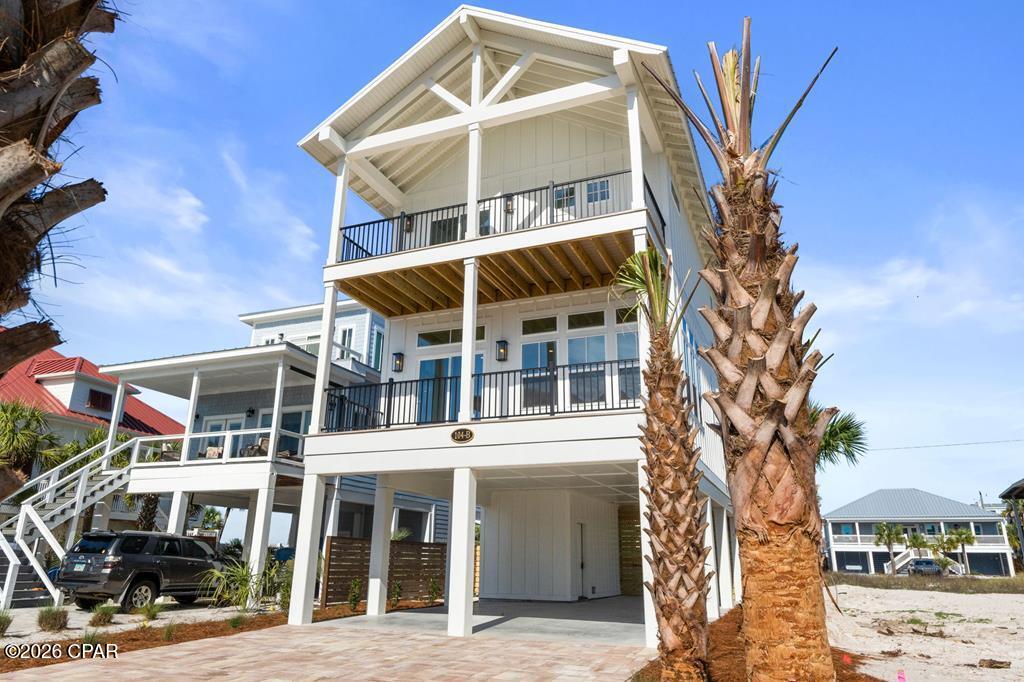 CURRENTLY UNDER CONTRACT, SELLER ACCEPTING BACKUP OFFERS. Welcome to 104 B 26th St, a brand new 4BR/4.5BA home with a pool on the beachside of Mexico Beach. Located on a quiet street just a 100-foot walk to beach access, this 2,403 sq ft home was designed with both practicality and durability in mind. Inside, you'll find premium finishes throughout, including crown molding, Visual Comfort Lighting(Gold) fixtures, impact windows and doors, and spray foam insulation. The kitchen is set up perfectly for entertaining with GE Café appliances, top-of-the-line Brizo plumbing fixtures, a gas range with an electric oven, quartz countertops with a waterfall island, tile backsplash, under-cabinet lighting, and cabinetry that extends to the ceiling. The main living area is bright and open with balcony access and Gulf views right from the couch. The first floor features a bedroom with a private bathroom and oversized walk-in closet, while both second-floor guest bedrooms also have their own private bathrooms with tiled tub showers, the spacious laundry room, and an open-cased organizing/storage room, adjacent to the laundry room. The primary suite stands out with vaulted ceilings, unobstructed Gulf views, and a private covered balcony with DuxxBak waterproof decking. The bathroom includes dual vanities and a large walk-in closet with built-in shelving. Outside, the fenced backyard offers a private saltwater pool featuring travertine pool pavers, a 6-foot privacy fence, and low-maintenance landscaping. With parking for up to six vehicles, a downstairs beach storage room, and strong rental potential, this property checks a lot of boxes in Mexico Beach. Call today!