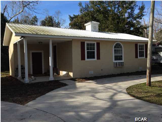 This charming 2 bedroom, 1 bath home is newly renovated inside & out. Open floor plan with spacious living room. Interior & exterior newly painted, upgraded lighting fixtures, new ceiling fans, all new carpet in the living room & bedrooms, beautiful new laminate plank wood flooring installed in the entry way, kitchen/dining area, hall & bathrooms. The kitchen has plenty of storage for all of your kitchen items and has a new refrigerator & stove/oven. This home has a separately enclosed laundry room with easy access from the front patio. Circle driveway, wall heat/air, nice yard space. Some pets are negotiable with a non-refundable $150 per animal fee. Pets must be 25lbs or less