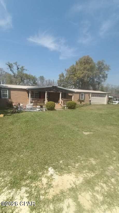WOW,  The possibilities for a great Fish Camp on the Dead Lakes  almost 1 acre.  The owner had started to rehab but has to return to the North.  This property offers 2 large bedrooms, 2 Baths.  There are a lot of positives but with some TLC this could be a great getaway, Fish Camp or project started home.  The Lake is only 10/15 feet inside the wood line. and there are some older piles that a dock maybe reestablished on.  Large front and back, there is also a large unfinished garage with a dirt floor.  Like i said it needs TLC but the property has great possibilities. Quiet peaceful area.  Come check it out..