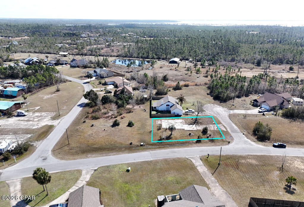 Great corner lot in highly desirable Sandy Creek Ranch. This .20 acre homesite is in a private community with all underground utilities available. Whether you're dreaming of crafting your ideal home, creating a peaceful retreat, or developing an investment property, this prime location offers great potential. The .22 acre cleared lot behind it is also available to expand your needs. Quick access to Tyndall Air Force Base and a breezy drive to shopping, restaurants, marina, and Panama City Beach. Great area with lots of lakes, ponds, and waterways connecting to the Gulf of Mexico. Ideal for those seeking relaxation and convenience.