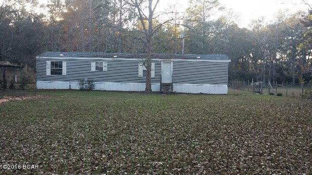 Great property just outside of town with 2 singlewide mobile homes and several outbuildings , all on 7.50 acres. The 2003 s/w is like new and has a brand new central unit ,very clean and nice. The 1981 s/w has a screened in front porch across the front, new roof, central unit ,doors and flooring .Home is very clean and is in great shape.Both homes are move in ready and have had several updates to them.This property has a beautiful Large oak tree that shades the front part of one of the homes by the road. The property is fenced and has a nice garden area in back and several trees too. Would make great rental properties or for family to be close. Live in one and rent one to help make your payment.