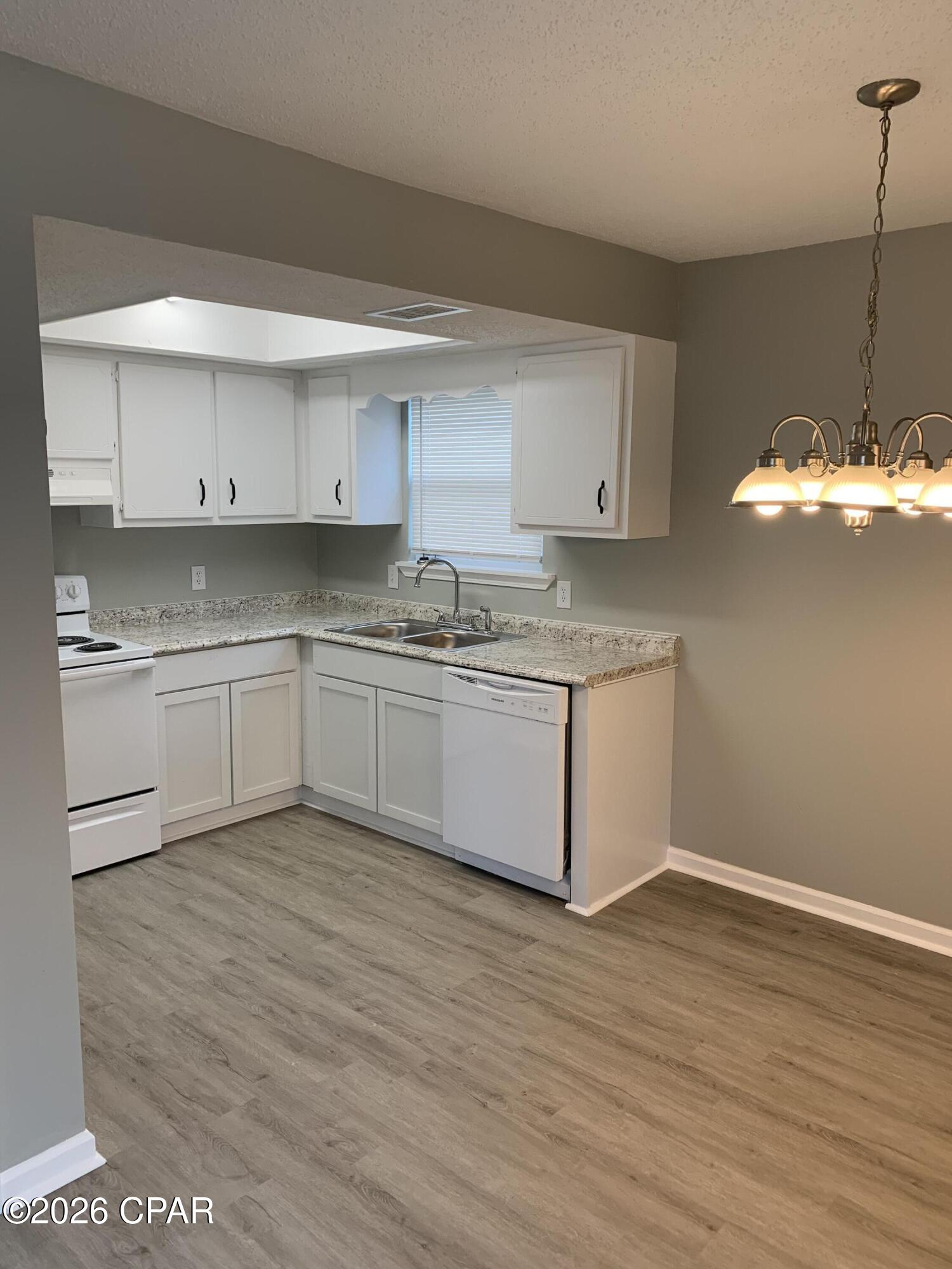 2-bedroom, 1-bath, neat and clean 2nd floor apartment in Panama City Beach, FL, off Joan Ave. This all-electric unit features vinyl plank flooring and a bright, airy layout. The primary bedroom includes a private balcony, and the kitchen comes with a dishwasher. Washer/dryer hookups are included. Ideal for those seeking a well-maintained, comfortable living space in a desirable beach area location.