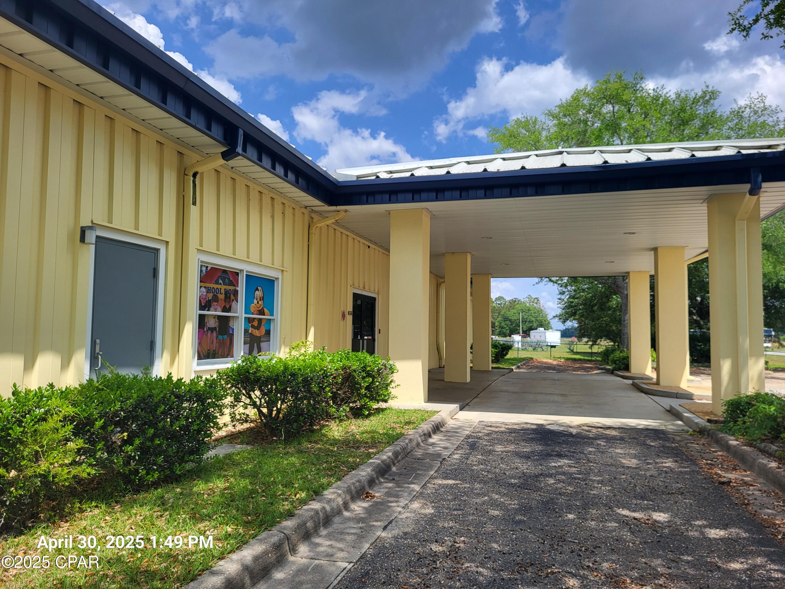 SELLER FINANCING and LEASING are Options that are Available with this Property. 6169 sq ft COMMERCIAL BUILDING available in Marianna, FL   With 7291 Sq Ft under roof the Modular Metal Roof with finished metal walls and steel frame make this a safe and strong building. Originally built for a Child Care Center, with rooms, bathrooms, commercial kitchen and more, it is currently approved for Maximum Licensed Capacity of 91.  But, don't miss out on the possibilities of this building for may uses. near the Marianna Airport and many manufacturing jobs, this building can be used for Child Care, Business Offices, Administration, or a Training Center,  Within walking distance to Marianna K-8 School, Jackson County Administration and the Jackson County Health Department.  Jackson County is Economic Development Conscious!  Contact the Jackson County EDC Director for options that may be available for New Businesses and Incentives that may be available for your business.  Located on a paved road and being in an industrial area, surrounded by Schools, Businesses and County Offices make the a perfect place for a growing business. Building is move-in ready for a licensed Child Care Center