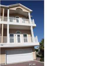 FURNISHED 3 Bedroom, 2 bathroom condo with amazing GULF VIEWS. The home features tiled living areas, granite counter tops, wood cabinets & stainless steel appliances to include a dishwasher, cathedral ceilings, Large master bedroom with walk in closet & master bath with whirlpool tub. Beautiful furnishings to include a washer & dryer. Oversized double garage with plenty of storage -you could fit 4 cars easy + space left over. Secure complex and convenient complex elevator. Close to Pier Park and beach access right across the street! Small dog neg.