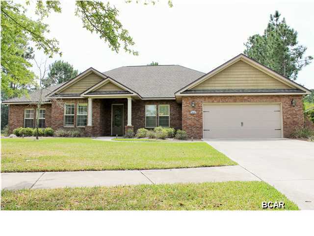 Hawks Landing one of a kind!!! THIS gorgeous CUSTOM BUILT HOME IS WAITING FOR YOU!!! It sits quietly tucked into the corner of a cul-de-sac backed into a natural setting. This will be your forever paradise as you sit on the back paved, enclosed decking that surrounds your salt water pool and hot tub overlooking the pond while having barbecues and entertaining your friends! As you walk into this home you will fall in love with the custom features that include hardwood floors, coffer ceilings, wainscoting, crown molding, gas fireplace, plantation shutters throughout, custom solid wood stained cabinets, under cabinet lighting, granite tops, top of the line stainless steel appliances, oil rubbed bronzed plumbing fixtures, security system with video surveillance, surround sound system on
