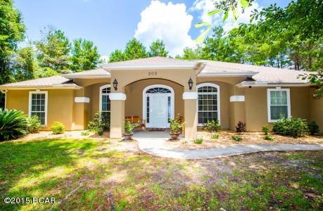 4 bed/3 bath home on 1.43 acres of land. The lot has a wooded buffer all around the home for privacy, a long concrete driveway, and a 2 car side-entry garage. The home will draw your eyes to the Wood Burning Fireplace, custom mantle, open floor plan & all the upgrades the home offers. In the kitchen you’ll see Granite Counter tops, plenty of space, Custom Cabinets, Under & Over Cabinet Lighting, Energy Efficient Appliances, Smooth Top Stove, & Breakfast Area. The home has Tile in Foyer, Kitchen, & Bathrooms. The main living area has Laminate Wood floors & 10ft ceilings. The Master Bed Room has Bamboo Floors & a custom tray ceiling. The additional bedrooms have carpet. In addition, the home is wired for 5.1 surround sound, Outside Speakers, & an alarm system. Also a Fenced-in back yard.