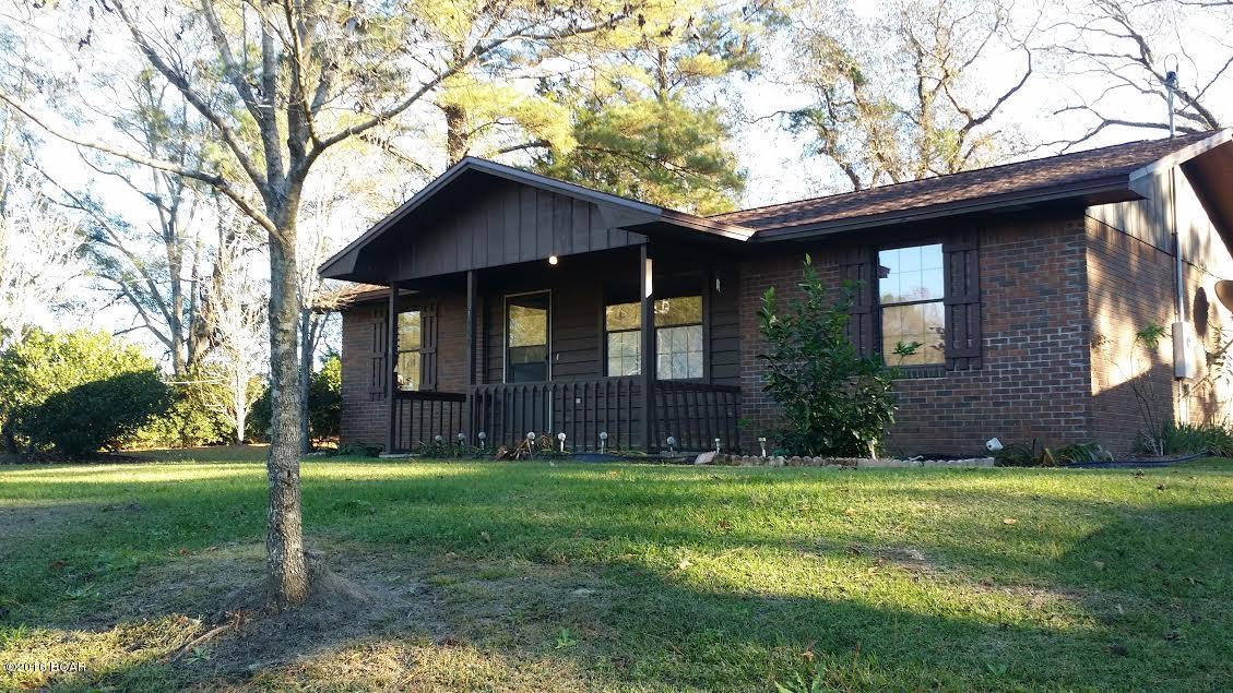 Well maintained 3/1 brick home on corner 1 acre in Westville. Kitchen has wood cabinets, dining area. Spacious living room. Split floorplan. CH/A, security system, new roof added in 2013. Covered front porch. Outbuilding with electic and window unit. Detached carport. Lots of azaleas border the property. Yard has peach, pear, orange, persimmon, satsuma trees. Great starter home. Priced to sell.