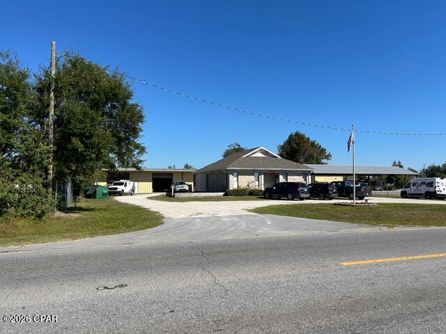 2824 Highway 2321 is a well-designed commercial office building located in Southport or northern Bay County. The  building consists of approximately 1,630 square feet of office space including: 4 large private offices, a spacious foyer/welcome area, conference room, coffee bar with sink, technology or IT room, and more. 

A +/- 4,500 square foot warehouse on the property can be leased separately. The warehouse includes: 4-12' x12' roll up doors, 14'-16' clear ceiling height, spray foam insulation, and 110 /220V power with the possibility to increasing to 3 phase power if necessary. The warehouse can be leased separately for $3,000 NNN per month.

The property is zoned C-3A General Commercial Low use, allowing a variety of retail, office, service-related businesses and some light manufacturing. 

Please call agent for showing instructions.