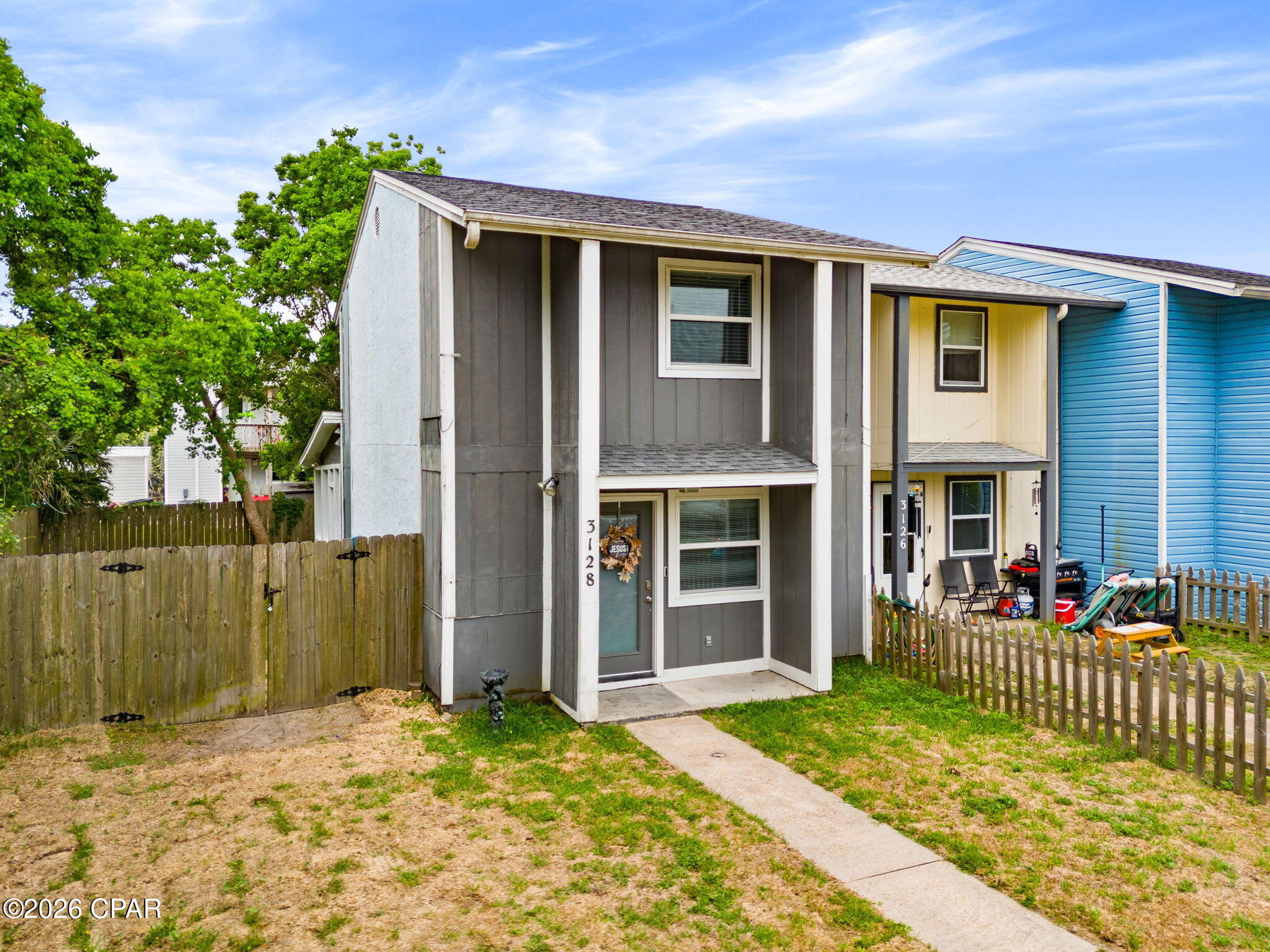 This well-maintained 3-bedroom, 1.5-bath end-unit townhome offers a convenient Panama City location close to shopping, schools, dining, and the beach. Tyndall Air Force Base is approximately 10 miles east, while Pier Park is approximately 17 miles west. Inside, you'll find low-maintenance laminate flooring downstairs and comfortable carpet upstairs. The downstairs bedroom/laundry area opens to a charming sunporch--perfect for relaxing with your morning coffee or afternoon tea. Enjoy added privacy with a fenced backyard. This property makes an excellent rental investment, a great option for first-time homebuyers, or those looking to downsize and enjoy low-maintenance living. If important, all measurements should be verified by buyer.