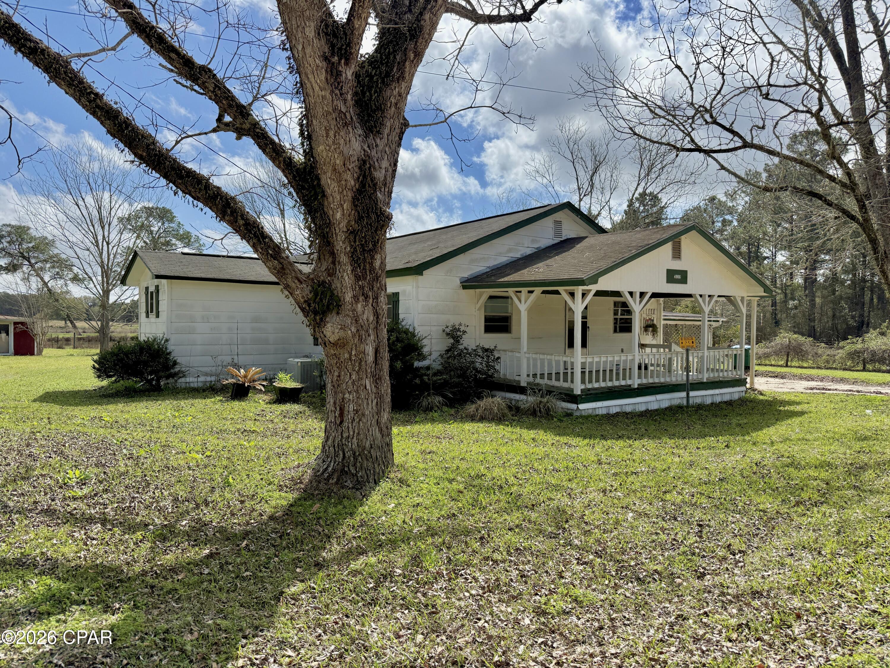 Beautiful 42-acre country property located just southeast of Graceville, Florida, offering a great combination of pasture land, water, and functional farm improvements. This property would make an excellent small farm, horse property, or rural homesite in the Florida Panhandle.

The land is approximately 80% open pasture and is fenced behind the home, providing ideal conditions for livestock, horses, or agricultural use. A scenic pond of approximately one-third acre sits just behind the home and can be enjoyed from the back sunroom overlooking the yard and water.

The 1,548 square foot home is well-maintained and offers 2 bedrooms and 1 bathroom, with several areas that could potentially be converted into a third bedroom if desired. The home features a large front porch that provides a welcoming entry and a great place to relax and enjoy the peaceful country setting. A two-car attached carport is located on the side of the home for convenient covered parking.

Additional improvements include multiple barns and storage buildings, making the property well-suited for farm or hobby use. There are four total barns on the property, including two solid cinder block barns and two older wooden barns that provide additional storage or livestock shelter. Mature pecan trees add character to the property and enhance the traditional farm setting.

The home is served by private well and septic.

This property is conveniently located in the rural countryside while still providing easy access to nearby towns and amenities.

Location:

Approximately 5 miles southeast of Graceville, Florida

Approximately 22 miles south of Dothan, Alabama

Approximately 60 miles north of Panama City, Florida

Approximately 80 miles northeast of Destin, Florida

This is a great opportunity to own a versatile farm property with pasture land, water, barns, and a well-maintained home in the Florida Panhandle.