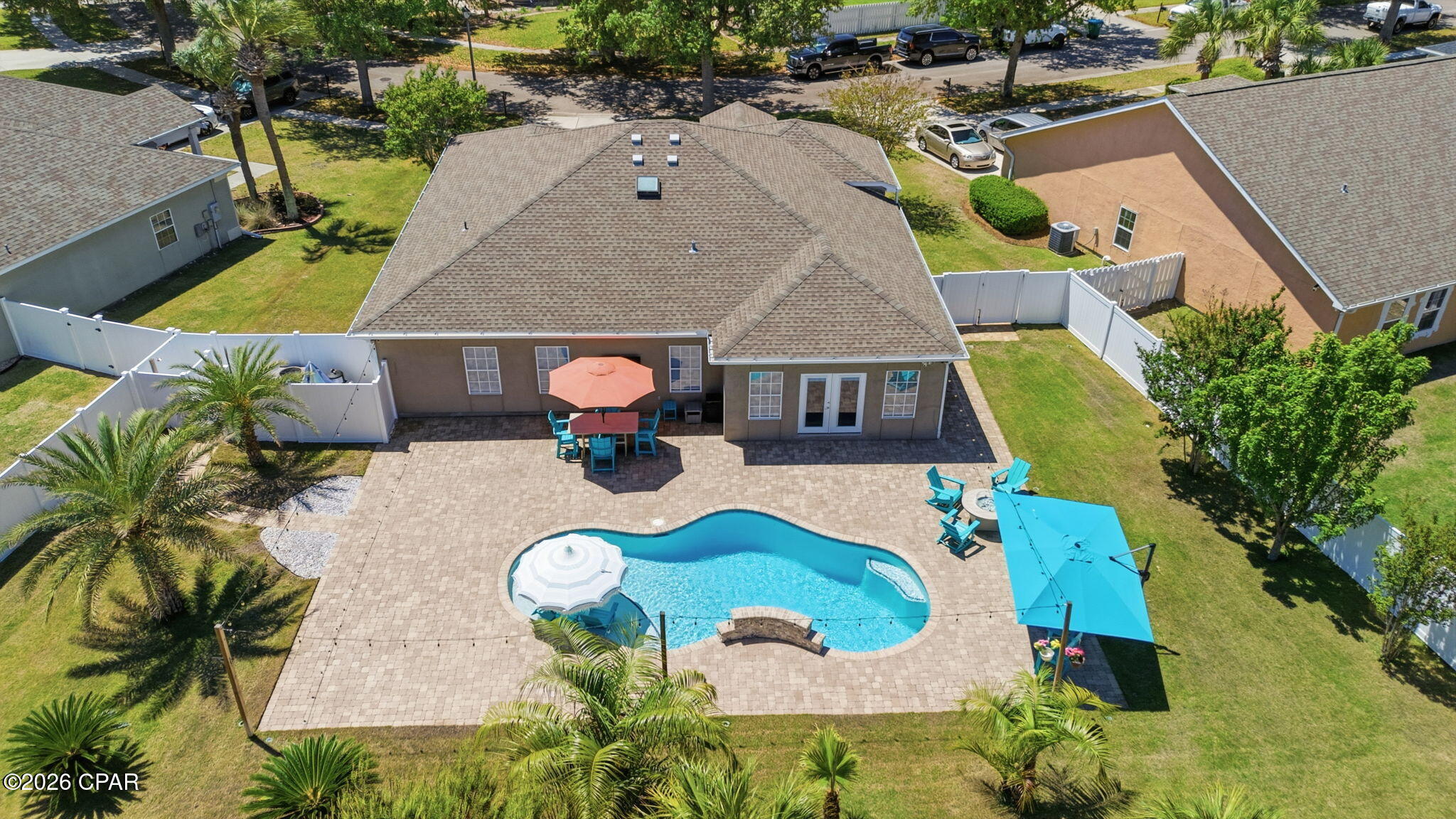 Look no further because this is the Panama City Beach pool home you have been waiting for. Experience the ultimate Florida lifestyle in this meticulously upgraded residence perfectly positioned in a quiet, non-short-term rental neighborhood. Whether you are seeking a coastal primary residence or a private secondary vacation home, this property offers the rare combination of proximity to the action and the peace of a true residential community. 

Step inside a home that feels brand new, boasting a comprehensive interior refresh. The spacious layout is enhanced by crown molding and fresh paint throughout the entire interior. These features include a tasteful blend of durable vinyl planks and plush carpet installed in 2022 alongside a chef's kitchen and updated laundry area. Fully equipped with a 2023 appliance suite, you will find a new refrigerator, stove, dishwasher, washer, and dryer already in place. There is also a dedicated office that can easily serve as a fourth bedroom or a custom hobby space. The primary bathroom received a refreshed remodel in 2023 with new vanities, modern lighting, and a bright new skylight.

The exterior is a masterclass in outdoor living and was transformed in 2023 into what is arguably the best private pool and backyard oasis in Panama City Beach. This luxury resort-style pool features premium gunite construction, saltwater systems, and a relaxing waterfall. It is also fully equipped with heating and cooling capabilities for year-round enjoyment regardless of the season. The entire property has been professionally landscaped with new sod and palm trees, all secured by a new six-foot vinyl fence for maximum privacy.

This home is as functional as it is beautiful, offering significant savings on utilities and peace of mind during those hot Florida months. The roof was replaced in 2021 and the central air conditioning system is only a few years old. Furthermore, the attic was upgraded with spray foam insulation to provide maximum temperature control which can offer incredible long-term savings. Recently added fabric hurricane shutters help protect your home from storms while the solid stucco siding provides both structural protection and a classic coastal vibe. 

Location is everything in real estate and this home delivers. You are situated directly across the street from Pier Park which offers world-class dining, shopping, and entertainment. Most importantly, you are located less than one mile from the sugar-white sands and emerald waters of the Gulf of Mexico. Schedule your private showing today to experience this turnkey coastal gem in person.
