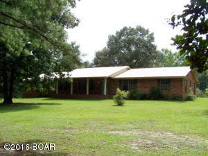 10 ACRES, 2880 SQ ft home with 4 br/3 b. New metal roof, new interior paint, updated C/E H/C, water heater, vinyl trim, kitchen and flooring. Has family room with brick fireplace, formal living and dining room. Garage was converted into living space and made a master suite. The acreage is partially fenced and horses, goats, ect are allowed. An out building was converted to office/living space with 1/2 bath. This home has size, acerage, buildings and all at a great deal. Please see the pictures and call for an appointment