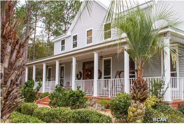 **JUST REDUCED $20,000!** Beautiful custom-built home on a quiet street on one of the largest lots in the Lynn Haven area. Located at the end of Graham Lane behind a country fence with remote controlled gate, this home is stunning. From the circular driveway to the over-sized double garage and the gorgeous 18x36 in-ground pool, this home has it all. With a 25 x 25 screened porch and a covered patio and pool house, this house is perfect for indoor and outdoor entertaining. A beautiful covered porch spans the front of the home and is perfect for those quiet evenings listening to the crickets. It even has an almost new (4 years old) metal roof. A master bedroom and two full baths on the first floor with four bedrooms and two full baths on the second floor make this an ideal home for a