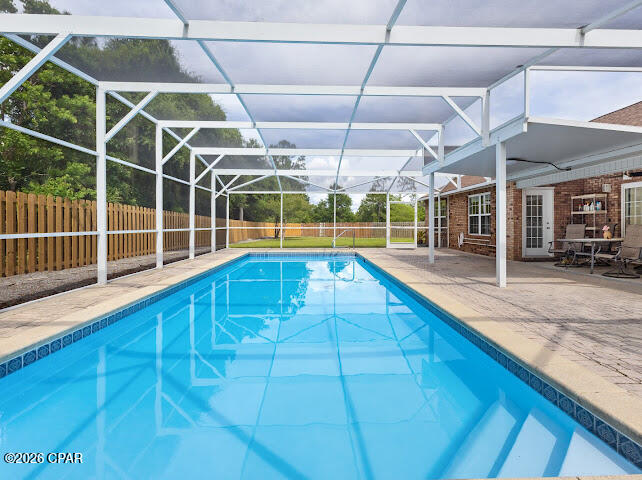 Welcome to your private slice of Florida paradise in desirable Lynn Haven. This beautifully refreshed pool home offers space, privacy, and thoughtful updates, all tucked away on a generously sized lot backing to a natural wooded setting with no rear neighbors.
Step inside to soaring ceilings, abundant natural light, and an airy open concept layout designed for comfortable everyday living and effortless entertaining. Fresh interior paint gives the home a crisp, move in ready feel, while spacious living areas flow seamlessly into the kitchen and out to the backyard retreat.

The kitchen features stainless steel appliances, abundant cabinetry, generous prep space, and a functional layout overlooking the main living area and pool, keeping everyone connected. A formal dining or flex space at the front of the home offers versatility for entertaining, a home office, or additional sitting area.

The oversized primary suite is a true retreat with dual vanities, a soaking tub, and a beautifully renovated spa inspired walk in shower with designer tilework and modern finishes.

Out back is where this home truly shines. Enjoy your oversized screened private pool enclosure with a sparkling in ground pool, expansive patio space, and the privacy buyers dream of. The large fenced backyard offers room for pets, play, or gardening. As an added bonus, residents also enjoy access to a community pool.

Additional highlights include a spacious laundry room, storage shed, vaulted ceilings, no rear neighbors, and a prime location near Bay Haven Charter Academy, shopping, dining, parks, beaches, and more.