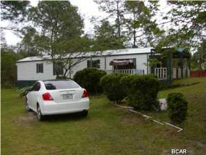 Make your appointment today to view this well kept home located in a country setting but just minutes from town. This home has a large kitchen island with a breakfast bar for plenty of room for guest or a growing family. There is also a bonus room that can be used as an office area or extra storage. Enjoy your summer days on the 1.18 acres that has great potential. There are also 2 large decks on the home and 2 storage buildings on the property. It also has a 20x20 pole barn located on the property. Survey available. Call today!