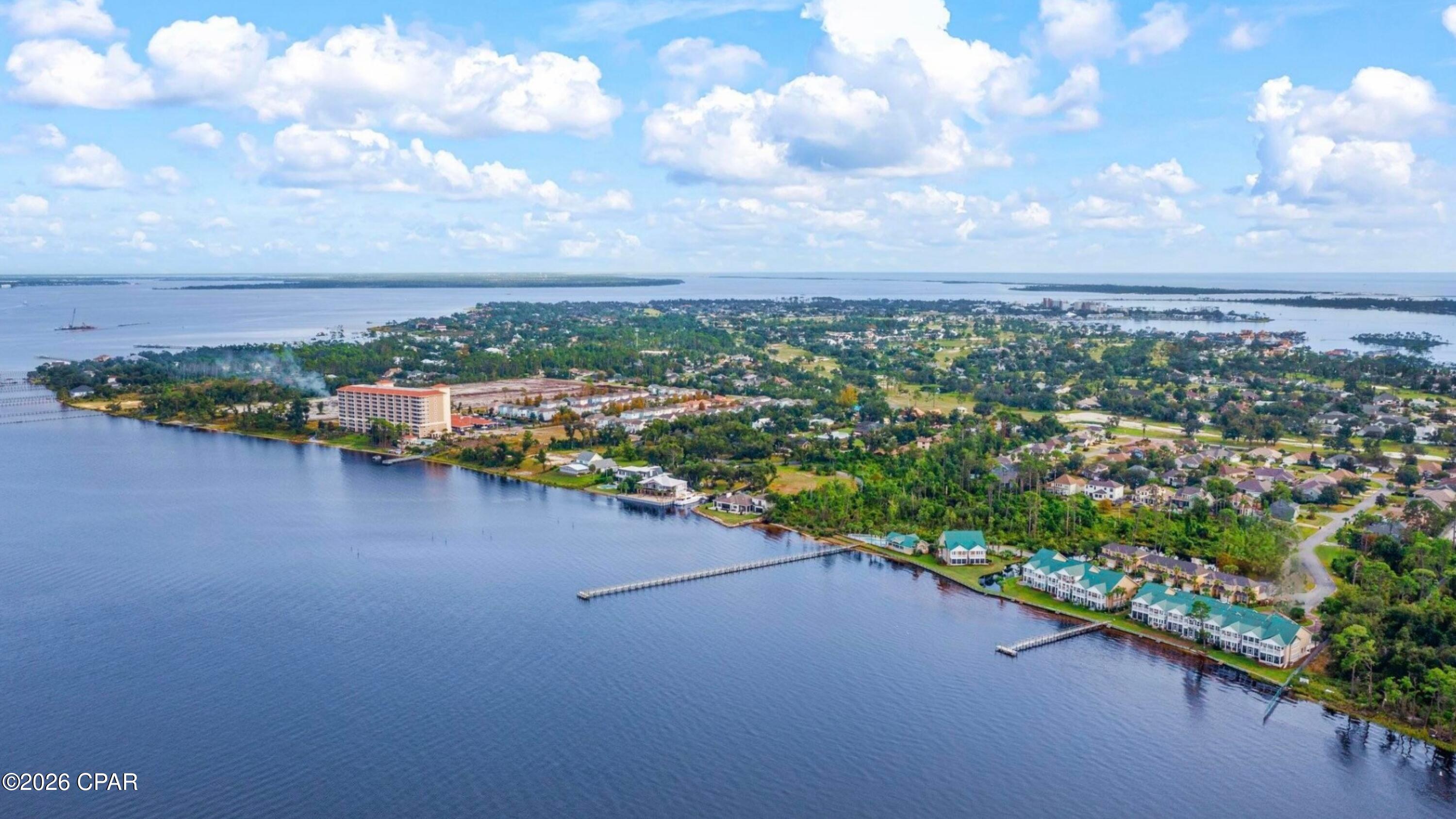 WATERFRONT TOWNHOME ON ST ANDREWS BAY!

Paradise awaits at Pelican Bay where bayfront living meets comfort, space, and stunning views. This beautifully maintained 3 bedroom, 2.5 bath townhome offers spacious living designed to capture the beauty of St Andrews Bay.

Step inside to a welcoming entry and open concept living and dining area, perfect for entertaining or relaxing after a day on the water. The space flows effortlessly to a screened patio, ideal for enjoying coastal breezes and peaceful bay views.

The spacious primary suite faces the bay and features bayfront balcony access, creating the perfect setting to enjoy breathtaking sunrise views each morning. 

This home also offers generous closet space, abundant storage, and updated flooring and paint throughout. Has been newly painted exterior as well.

Relax by the community pool, walk the pier, or launch a kayak right from the property. The community pier also offers day use boat access, making it easy to enjoy time out on the water.

Conveniently located just minutes from sugar white beaches, St Andrews State Park, golf courses, marinas, dining, and shopping at Pier Park, this home places you in the heart of everything the Emerald Coast has to offer.

Whether you are looking for a primary residence or a second home, this is bayfront living at its finest.

Wake up to the beauty of the bay. Paradise awaits you at Pelican Bay.