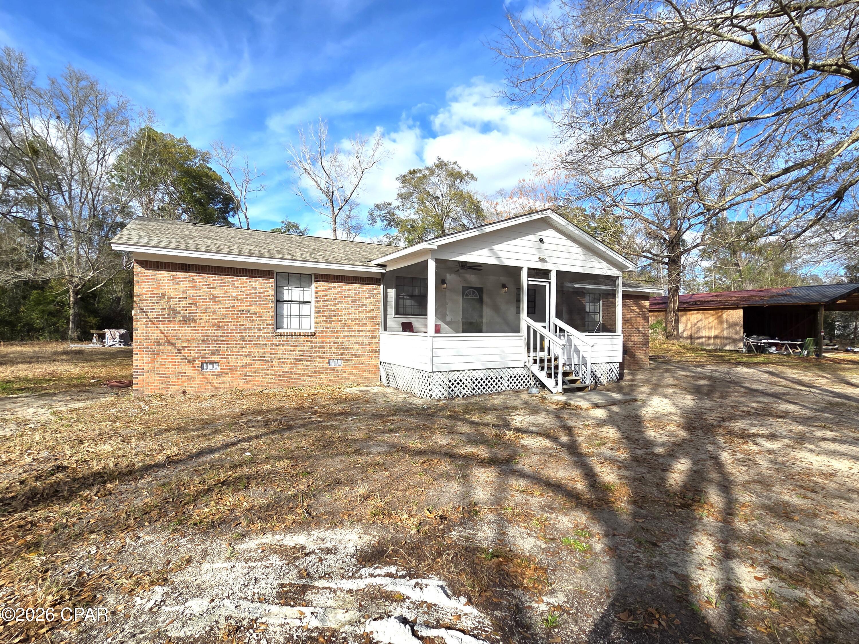 This stunning, totally remodeled residence at 12112 NW State Road 20, Bristol, FL, sits on a spacious 2-acre lot, offering peaceful rural living just outside the city limits with easy access to State Road 20. The home features a fresh, modern interior with new real wood flooring accented by elegant real wood inlays throughout, creating a warm and sophisticated atmosphere. All bullnose corners add a high-end, custom touch to the walls and transitions. The heart of the home is the completely updated kitchen, boasting new granite countertops, high-end appliances, and all-new kitchen appliances for seamless entertaining and daily living. A stylish wet bar provides the perfect spot for casual gatherings or morning coffee. Step outside to your private oasis: a sparkling inground pool with a brand-new liner and new pool pump with new black metal fencing, ready for year-round enjoyment in Florida's sunny climate. You can also enjoy the great Florida weather on the 21x10 screened front porch with two new ceiling fans.  Additional highlights include a new roof for peace of mind and two large pole barns one is approximately 84x40 and the other is approximately 40x28 with a concrete floor offering ample storage, workshop space - equipment protection or possible man cave for the pole barn with concrete floor.
This  move in ready home combines modern upgrades with generous outdoor spaces making it a rare find in Liberty County.