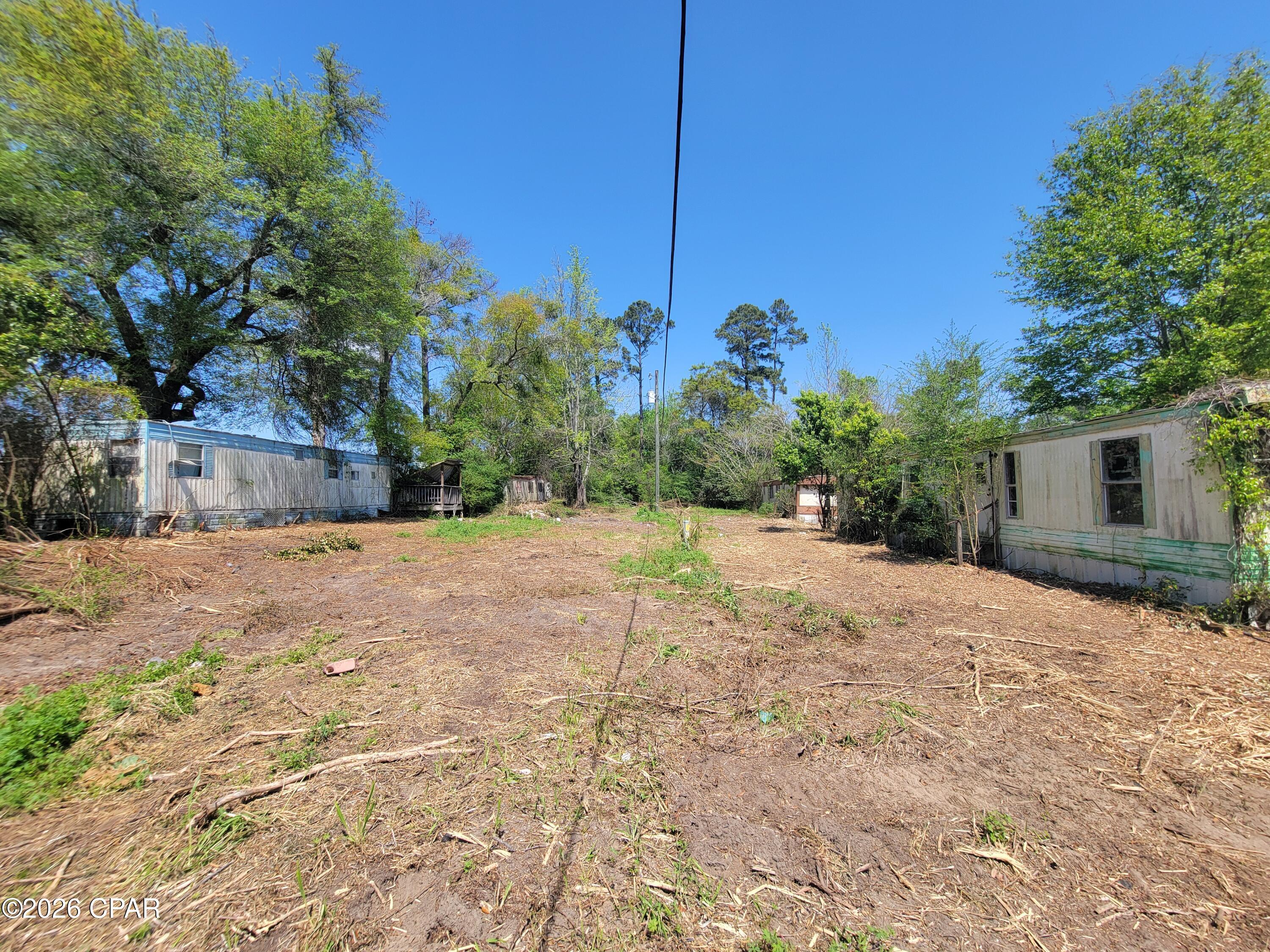 Investment opportunity with strong potential! This mobile home park features 10 units situated on a quiet dead-end road just minutes from town in Marianna. None of the units are currently in livable condition, offering a blank slate for redevelopment, renovation, or repositioning. Property includes one large well and six septic tanks already in place. Prime location combined with existing infrastructure creates numerous possibilities for investors or developers looking to add value.