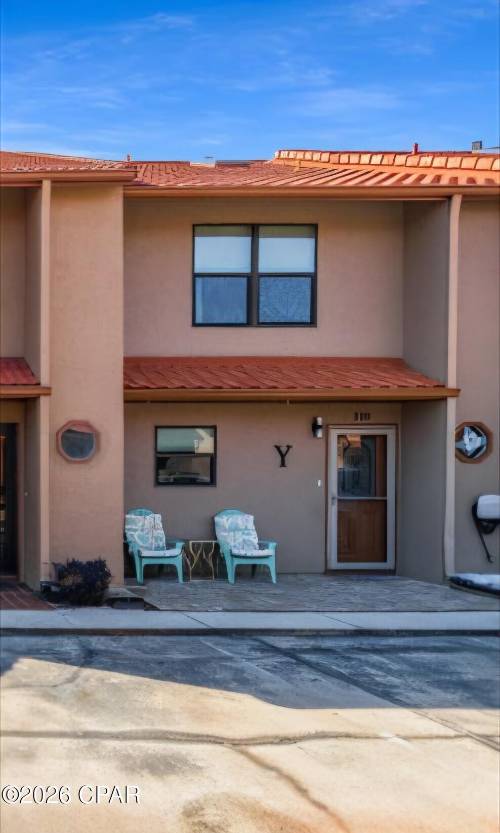 Grab your sunscreen and towel and take a stroll down to the warm white sands and cool blue waters of Panama City Beach! This updated townhome in Gulf Highlands Beach Resort is fully furnished and ready for your family! Park directly in front of your unit in the two dedicated parking spots. No elevators to maneuver with groceries or beach toys! The large, open floor plan, full-sized kitchen with an oversized breakfast bar and abundant cabinet and counter space makes this the ideal place for friends and families to gather. The living area features sliding glass doors which lead to a lovely patio area with a view down the length of the canal! Sit on your deck and feed the turtles and watch the herons fish. Gulf Highlands offers an array of amenities including 11 swimming pools (5 heated), 3 tennis courts, pickleball, fitness center, mini-golf, 2 playgrounds, shuffleboard, conference center, and a private clubhouse featuring restaurant and pool overlooking the Gulf. Numerous entertainment options are available within walking or golf cart distance. This secure, golf cart-friendly resort offers an ideal environment for short-term renters and full-time residents alike. This unit has never been on a rental program but has a projected annual rental income of over 40K. The low HOA fees cover trash disposal, internet, landscaping, pool servicing, termite & pest control and upkeep of all amenities.  Age, Sq Ft, and dimensions approximate.