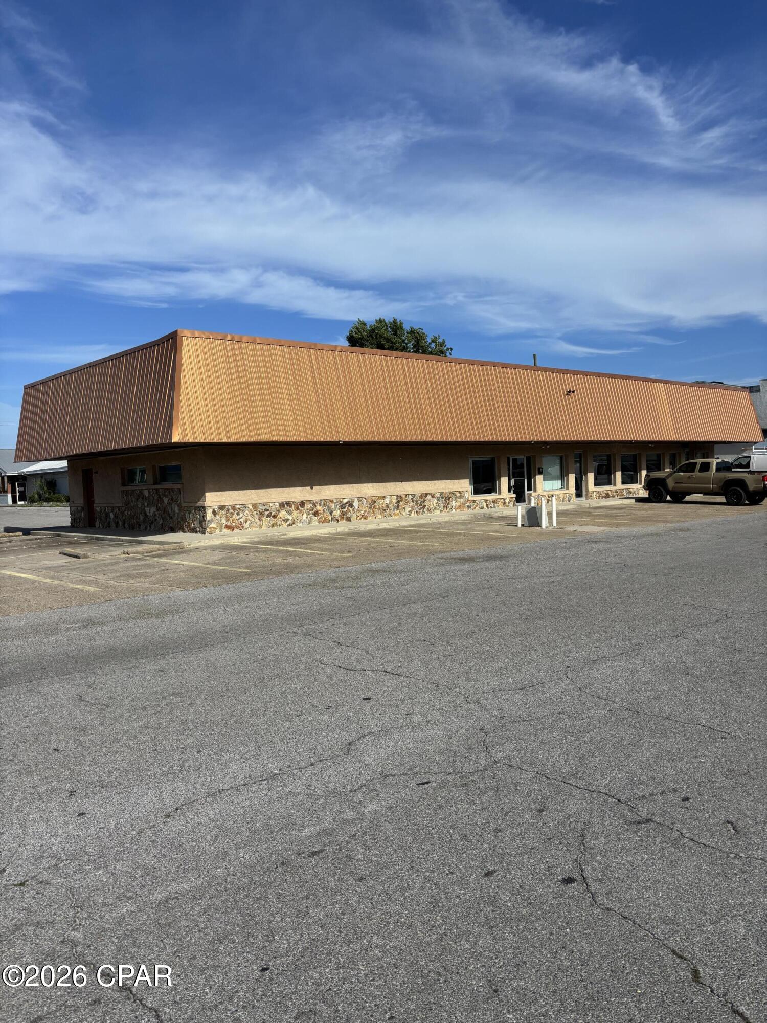 Very nice office/retail space just off Tyndall Parkway and South of the Winn Dixie Shopping Center and Planet Fitness. Lease it all or lease each of the two suites individually.  Space is ideal for office/retail use, small dance studio/martial arts studio type use, retail and/or professional office use. Suites A & B are interconnected and combine for a total of 2,460 Sq. Ft., or the suites can be leased separately.  Suite A is 1,650 Sq. Ft. and is available at $1,950/Month and includes a large open floorplan for reception area or showroom with 1 office/conference room, restroom and break & kitchen area.  Suite B is 810 Sq. Ft. and is available for $1,000/Month and includes a large reception area or showroom, 1 office, small breakroom area with sink and restroom.  This space is nicely appointed with ample parking and ready for immediate occupancy.