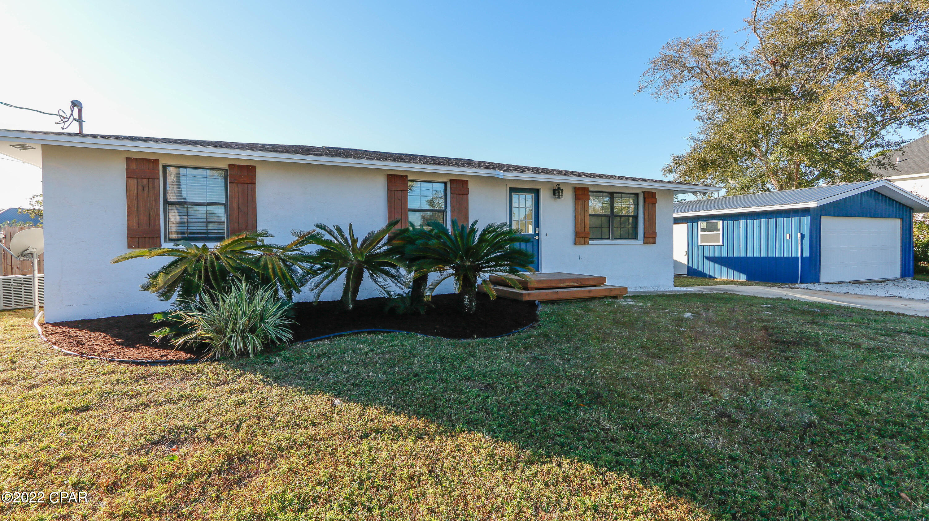 CURRENTLY UNDER CONTRACT, SELLER ACCEPTING BACK UP OFFERS! This Beautiful house will qualify for ReHouse Bay. Located at the end of a quiet dead end street in the Lynn Haven Community of North Ridge is a 3 bed 2 bath block home that has stucco on the exterior.  This solid Home has been completely renovated. New Kitchen layout with quartz countertops and stainless appliances. New glass in windows, Luxury wood laminate flooring throughout. Roof was put on 2019 and there is a new double car garage with metal roof and new garage door and opener. The back yard is Huge and totally fenced with a double cattle gate for easy in and out. Lots of parking for vehicles and toys alike. Home is on city water and septic, but the tap fees have been paid for sewer if you choose to get sewer. Don't miss out!